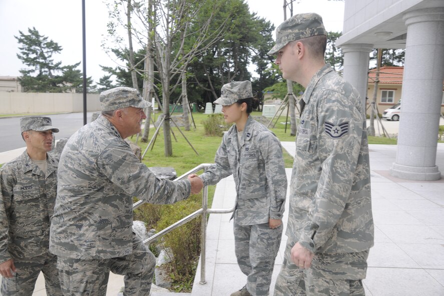 KUNSAN AIR BASE, Republic of Korea -- Gen. Gary L. North, Pacific Air Forces commander, listens as Col. Scott Pleus, 8th Fighter Wing commander, talks about the new dormitories and the better quality of life they offer for Wolf Pack members here Aug. 22.  During his visit, the general toured facilities and spoke to Wolf Pack members to reiterate their importance and roles.  (U.S. Air Force photo/Staff Sgt. Rasheen Douglas)