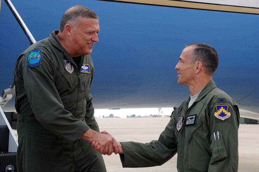 KUNSAN AIR BASE, Republic of Korea -- Col. Scott Pleus, 8th Fighter Wing commander (right) greets Gen. Gary L. North, Pacific Air Forces commander.  During his visit to Kunsan, the general toured facilities and spoke to Wolf Pack members to reiterate their importance and their roles.  (U.S. Air Force photo/Staff Sgt. Rasheen Douglas)