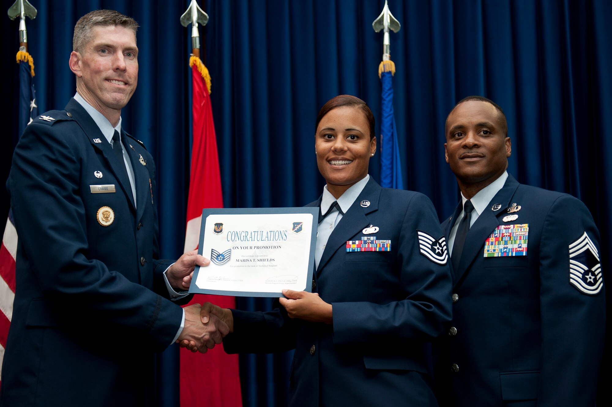 Marisa Shields, 39th Force Support Squadron, is promoted to the rank of technical sergeant Aug. 31, 2011, at the Club Complex ballroom at Incirlik Air Base, Turkey. (U.S. Air Force photo by Tech. Sgt. Michael B. Keller/Released)