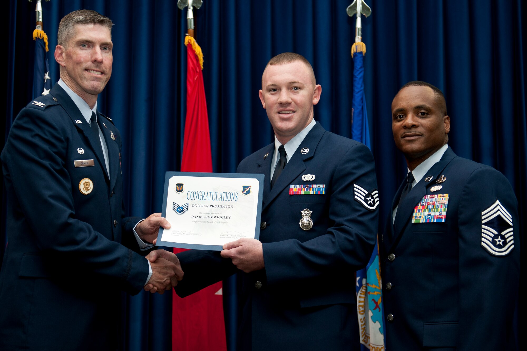 Daniel Wiggley, 39th Security Forces Squadron, is promoted to the rank of staff sergeant Aug. 31, 2011, at the Club Complex ballroom at Incirlik Air Base, Turkey. (U.S. Air Force photo by Tech. Sgt. Michael B. Keller/Released)