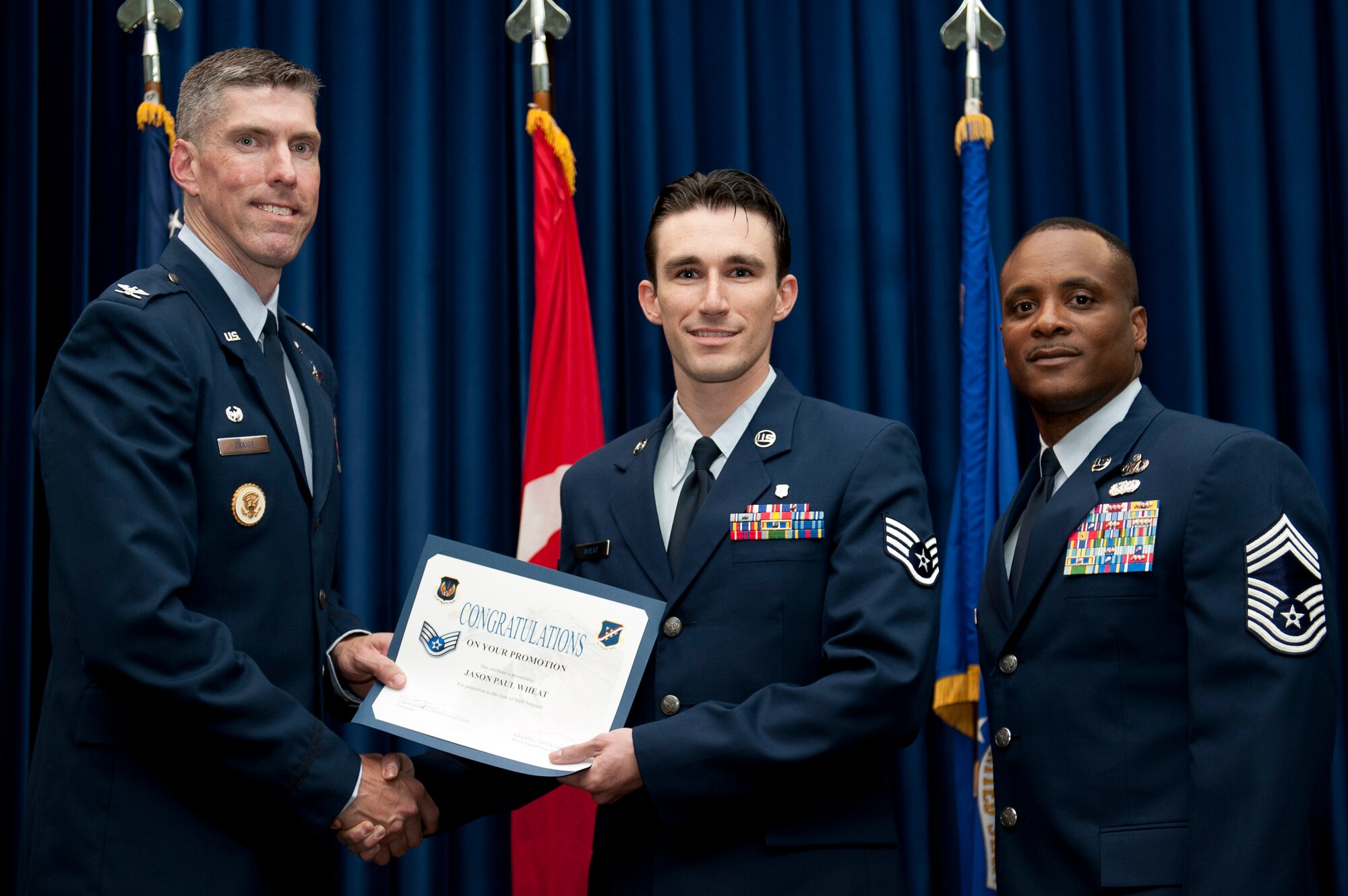 Jason Wheat, 39th Medical Support Squadron, is promoted to the rank of staff sergeant Aug. 31, 2011, at the Club Complex ballroom at Incirlik Air Base, Turkey. (U.S. Air Force photo by Tech. Sgt. Michael B. Keller/Released)