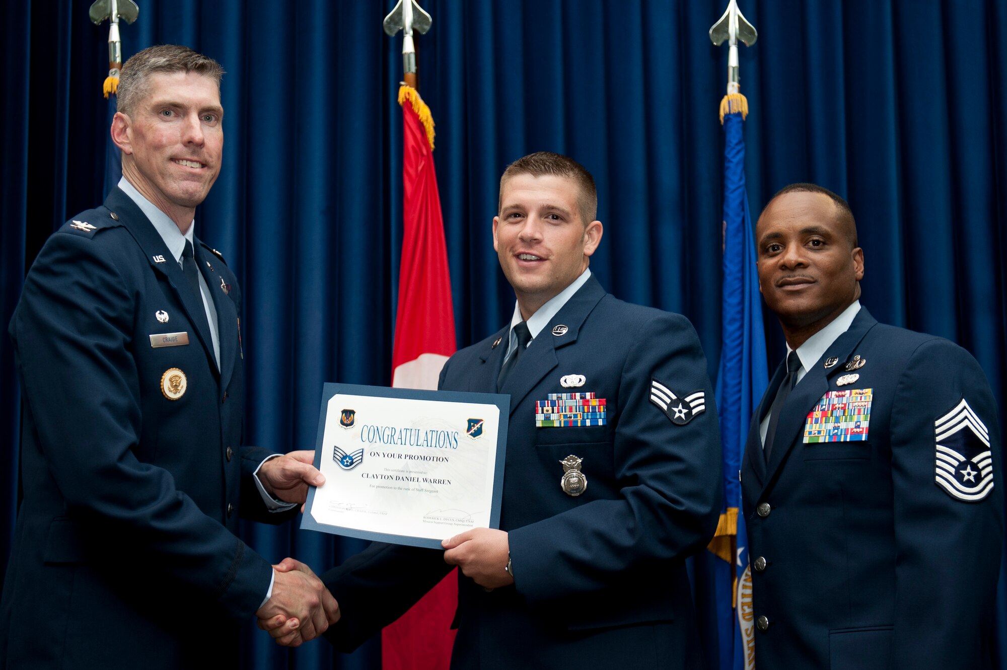 Clayton Warren, 39th Security Forces Squadron, is promoted to the rank of staff sergeant Aug. 31, 2011, at the Club Complex ballroom at Incirlik Air Base, Turkey. (U.S. Air Force photo by Tech. Sgt. Michael B. Keller/Released)