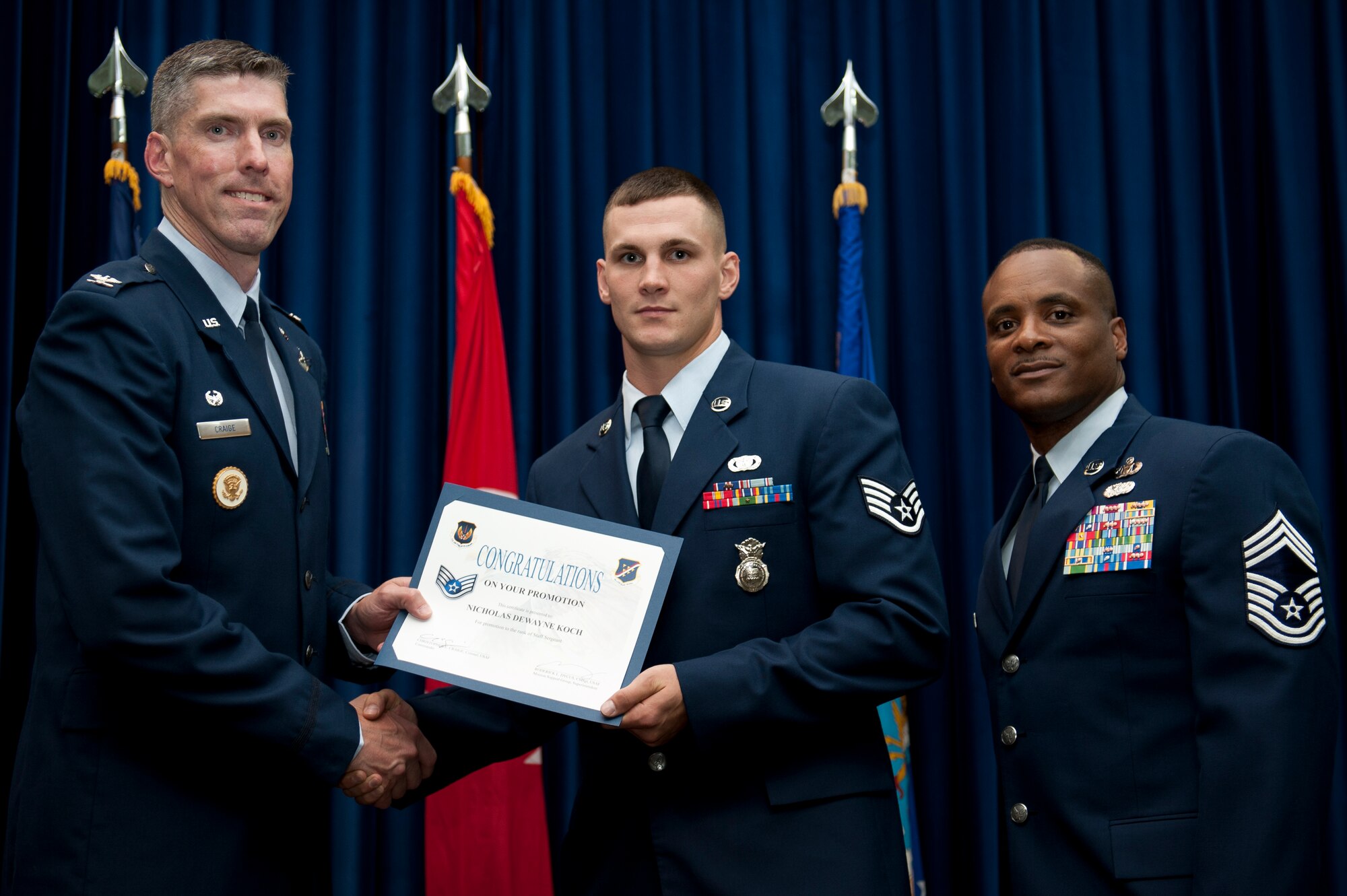 Nicholas Koch, 39th Security Forces Squadron, is promoted to the rank of staff sergeant Aug. 31, 2011, at the Club Complex ballroom at Incirlik Air Base, Turkey. (U.S. Air Force photo by Tech. Sgt. Michael B. Keller/Released)