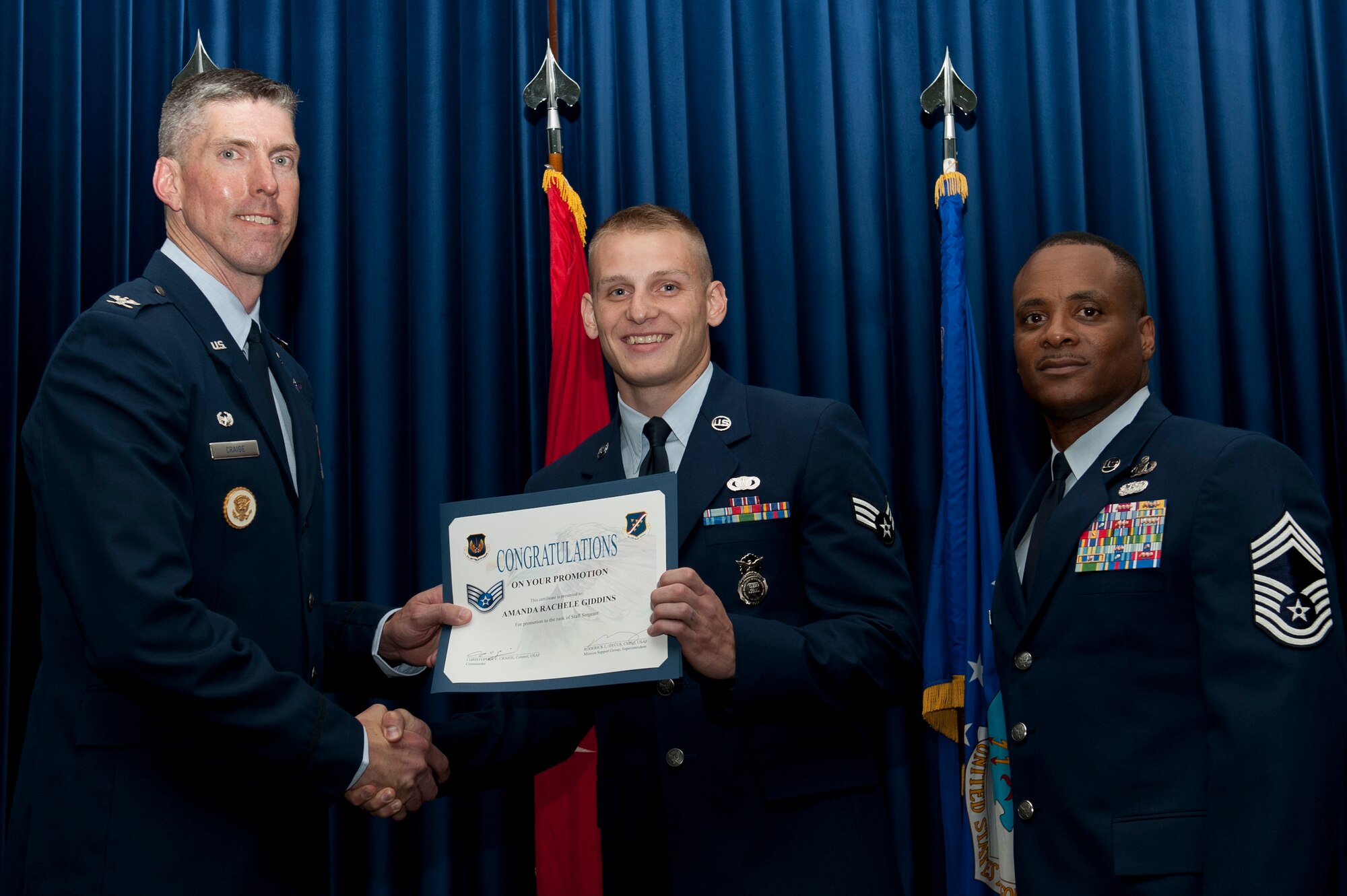 Isaiah Combs, 39th Security Forces Squadron, is promoted to the rank of staff sergeant Aug. 31, 2011, at the Club Complex ballroom at Incirlik Air Base, Turkey. (U.S. Air Force photo by Tech. Sgt. Michael B. Keller/Released)