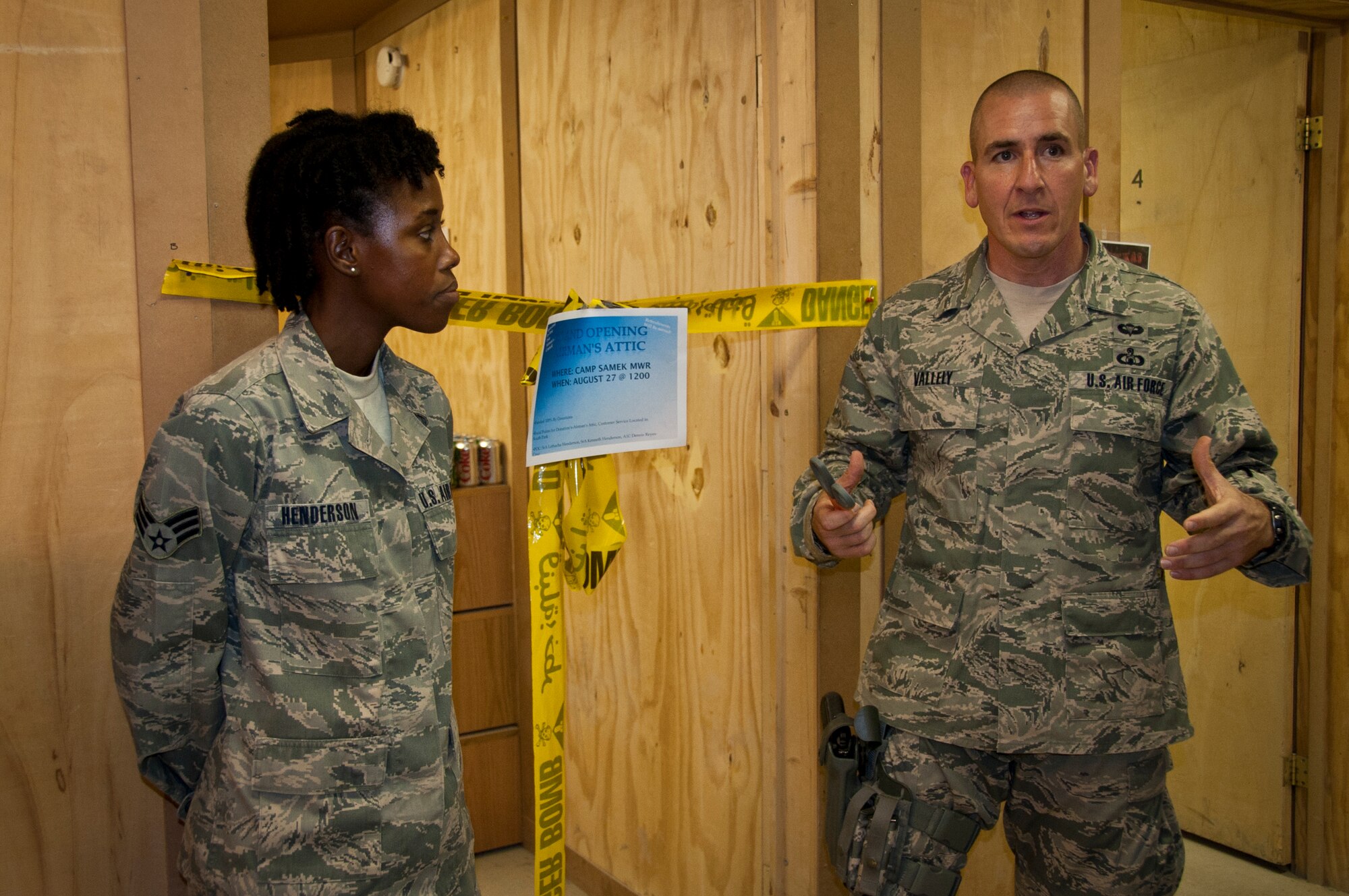 Chief Master Sgt. Thomas Vallely, 451st Air Expeditionary Wing command chief, speaks to the attendees of the Airman's Attic grand opening at the Camp Samek recreation center Aug. 27, 2011. Sponsored by the First Four Airman's Council, the attic is a facility where junior enlisted servicemembers can get free gently used goods that have been donated by fellow military members.  (U.S. Air Force photo by Senior Airman David Carbajal)