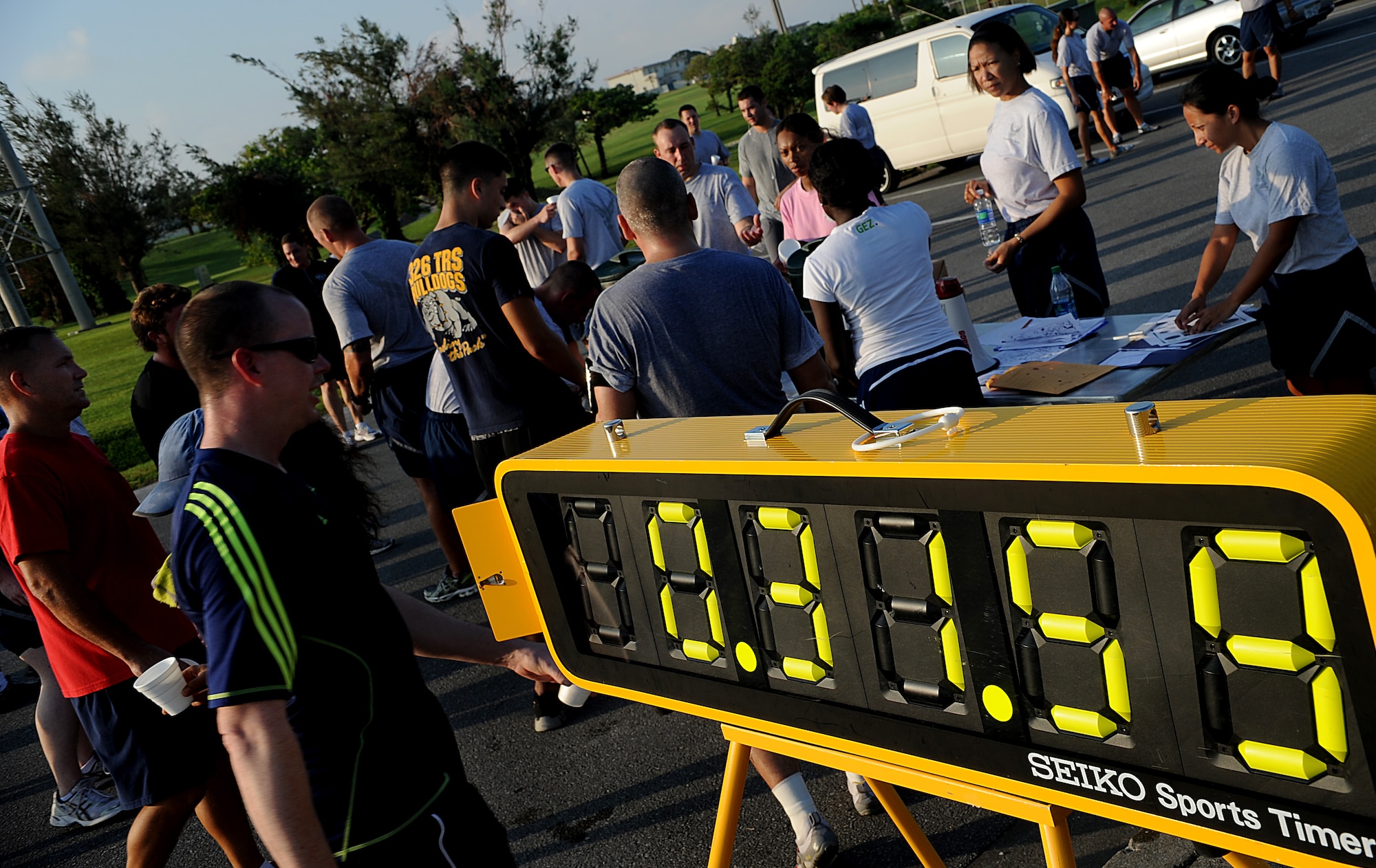 Participants of the 5k fun run designed to aid flood victims from Minot Air Force Base, N.D., gather at the finish line to hear the fundraising results. More than 130 Shogun Warriors raised $2,000 during the event. (U.S. Air Force photo/Staff Sgt. Christopher Hummel)
