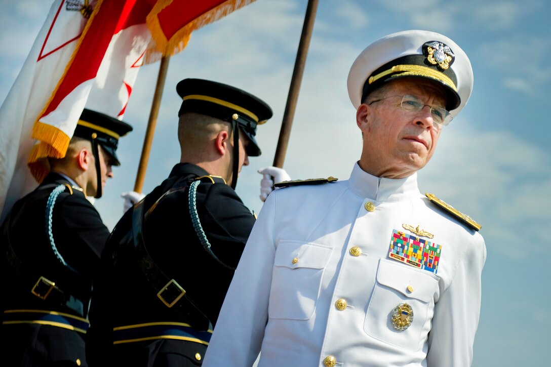 Navy Adm. Mike Mullen, chairman of the Joint Chiefs of Staff, attends Army Gen. Walter L. "Skip" Sharp's retirement ceremony at Summerall Field, Joint Base Meyer-Henderson Hall, Va., Sept. 1, 2011.