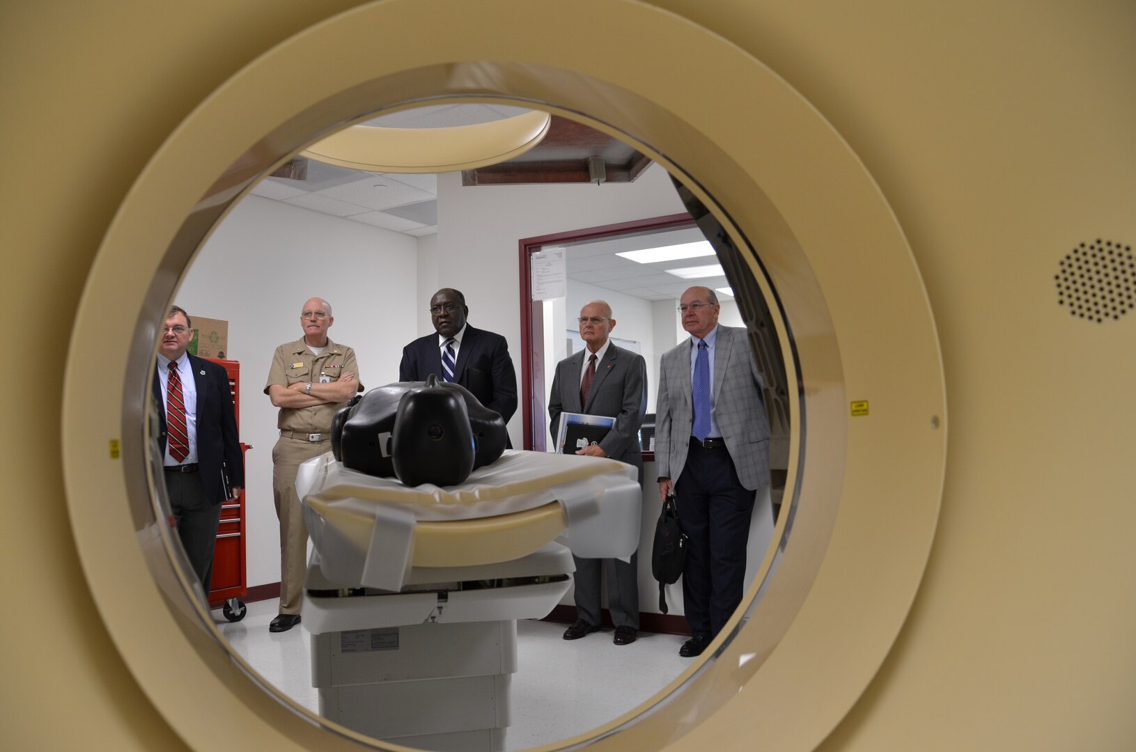 Rear Adm. Bob Kiser, Commandant, Medical Education & Training Campus, accompanies members of the Community College of the Air Force and subcommittee members from the Air University Board of Visitors during a tour of the radiology technician program. Radiology Tech is one of 64 programs taught at the Medical
Education & Training Campus (METC), a tri-service school established under the Base Realignment and Closure Commission (BRAC) to produce the world's finest Medics, Corpsmen, and Techs, supporting our Nation's ability to engage globally. (U.S. Navy photo by Dewite R. Wehrman/Released)
