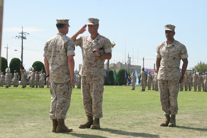 Sgt. Maj. Blake L. Smith, outgoing Marine Wing Support Squadron 171 sergeant major, renders a salute to Lt. Col. Michael C. Taylor, MWSS-171 commanding officer, as Sgt. Maj. Albert Diaz, oncoming MWSS-171 sergeant, looks on during a relief-and-appointment ceremony held the Building 1 parade deck here Sept. 1. Smith’s next duty station will be at Camp Pendleton, Calif. at School of Infantry-West.