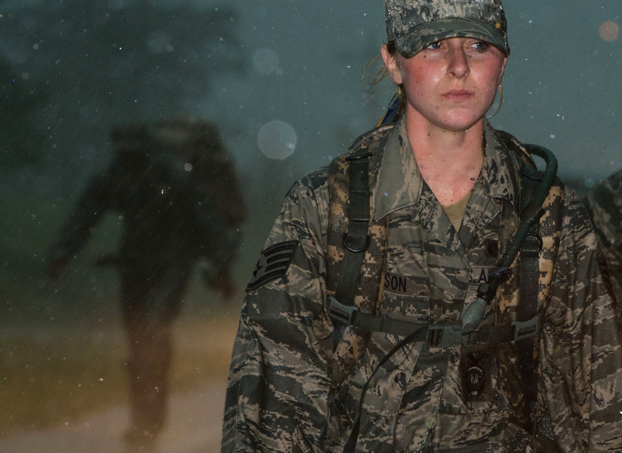 Staff Sgt. Deanna Dickson, a 192nd Security Forces Squadron patrolman, endures wind and rain during the Security Forces 9/11 Ruck March to Remember in Greenwood, Va., Aug. 25, 2011. Security forces squadrons from multiple bases are conducting a relay ruck march from San Antonio, Texas, to Ground Zero in New York City. The 192nd SFS is part of the Virginia Air National Guard. (U.S. Air Force photo/Tech. Sgt. Barry Loo)