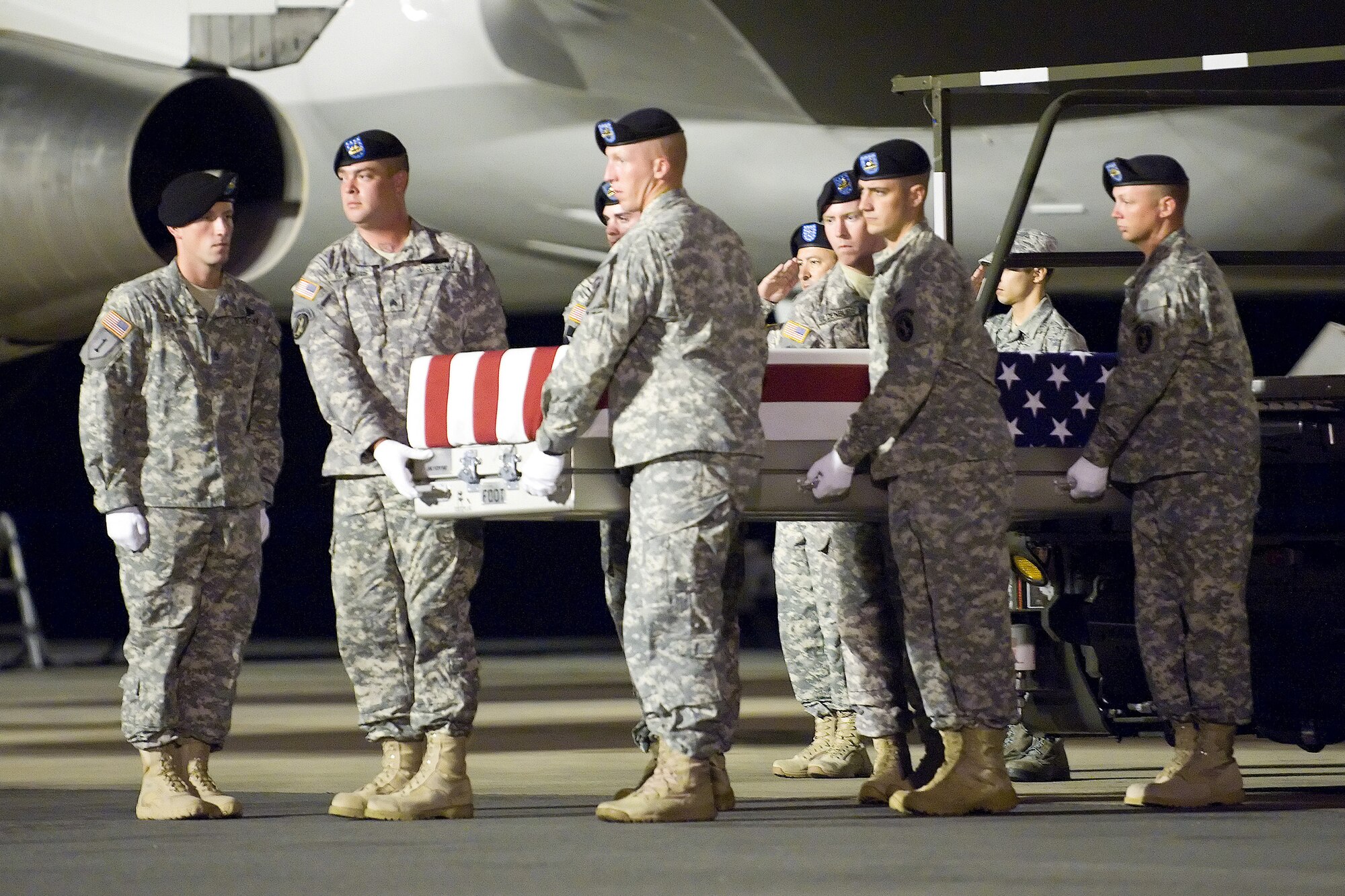 A U.S. Army carry team transfers the remains of Army Spc. Dennis James Jr. of Deltona, Fla., at Dover Air Force Base, Del., Sept. 2, 2011. He was assigned to the 2nd Battalion, 4th Infantry Regiment, 4th Brigade Combat Team, 10th Mountain Division, Fort Polk, La. (U.S. Air Force photo/Adrian Rowan)