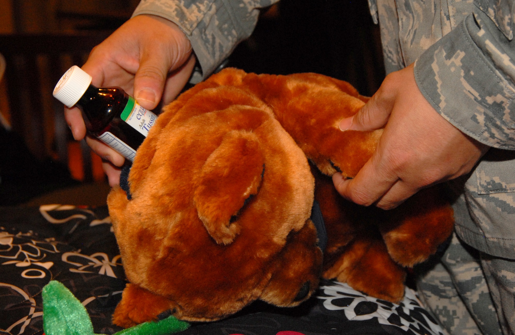 GOODFELLOW AIR FORCE BASE, Texas -- One of the hiding places for paraphernalia found in the Concho Valley CARES Coalition's mock bedroom during their Hidden in Plain Sight demonstration was inside of a stuffed animal.   The Parent Advisory Board, Drug Demand Reduction Office, Air Force Office of Special Investigations, Concho Valley CARES Coalition and the San Angelo Police Department teamed up Sept. 2 at the base theater to provide parents insight to the latest drug trends facing children today and ways to prevent use. (U.S. Air Force photo/Connie Hempel)