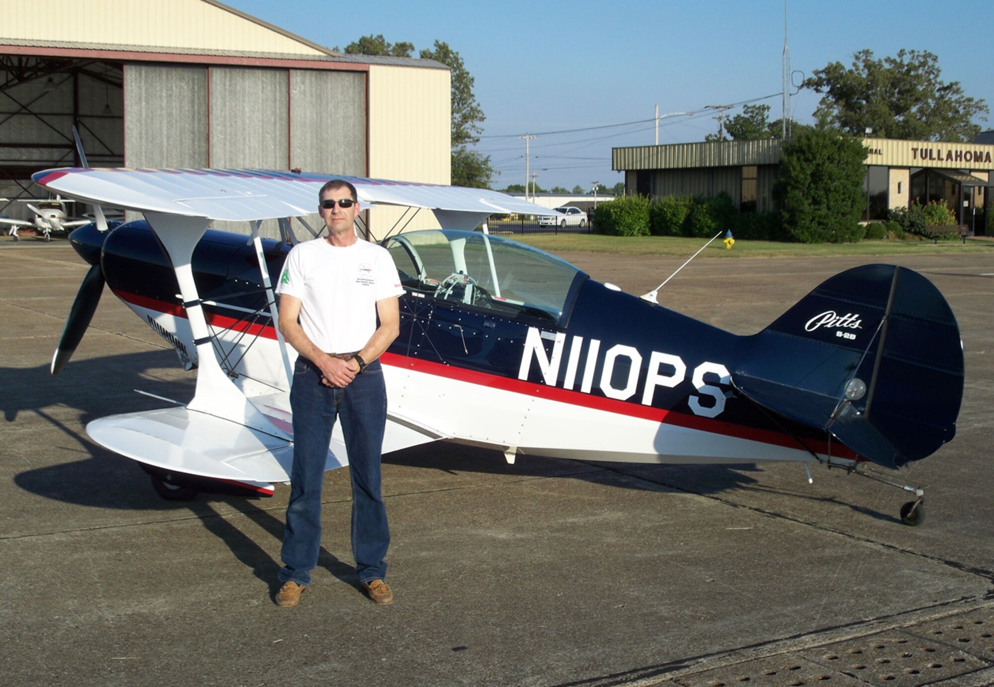 AEDC’s Tom Hartvigsen stands by his aerobatic airplane, Pitts S-2B, at the Tullahoma Regional Airport. (Photo provided) 