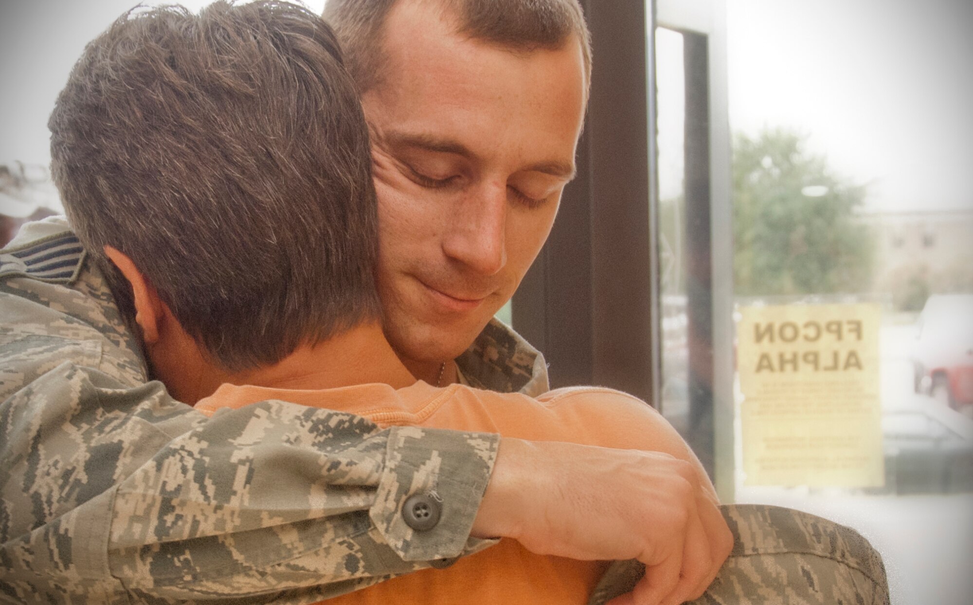 Tears of joy flowed in the Roberts Consolidated Maintenance Facility Sept. 1 as family members of a dozen 403rd Wing civil engineers welcomed them back from a six-month deployment to Southwest Asia. Among them was Staff Sgt. Thomas Frisbie, who was greeted at the door by his mother, Ms. Chris Bush. During a reception held in the Roberts Auditorium here, 403rd Wing commander Col. Jay Jensen commended the civil engineers, saying “Thank you very much for your service. I appreciate it and your nation appreciates it. We’re glad you’re back.” (U.S. Air Force photo by Master Sgt. Michael Duhe)       