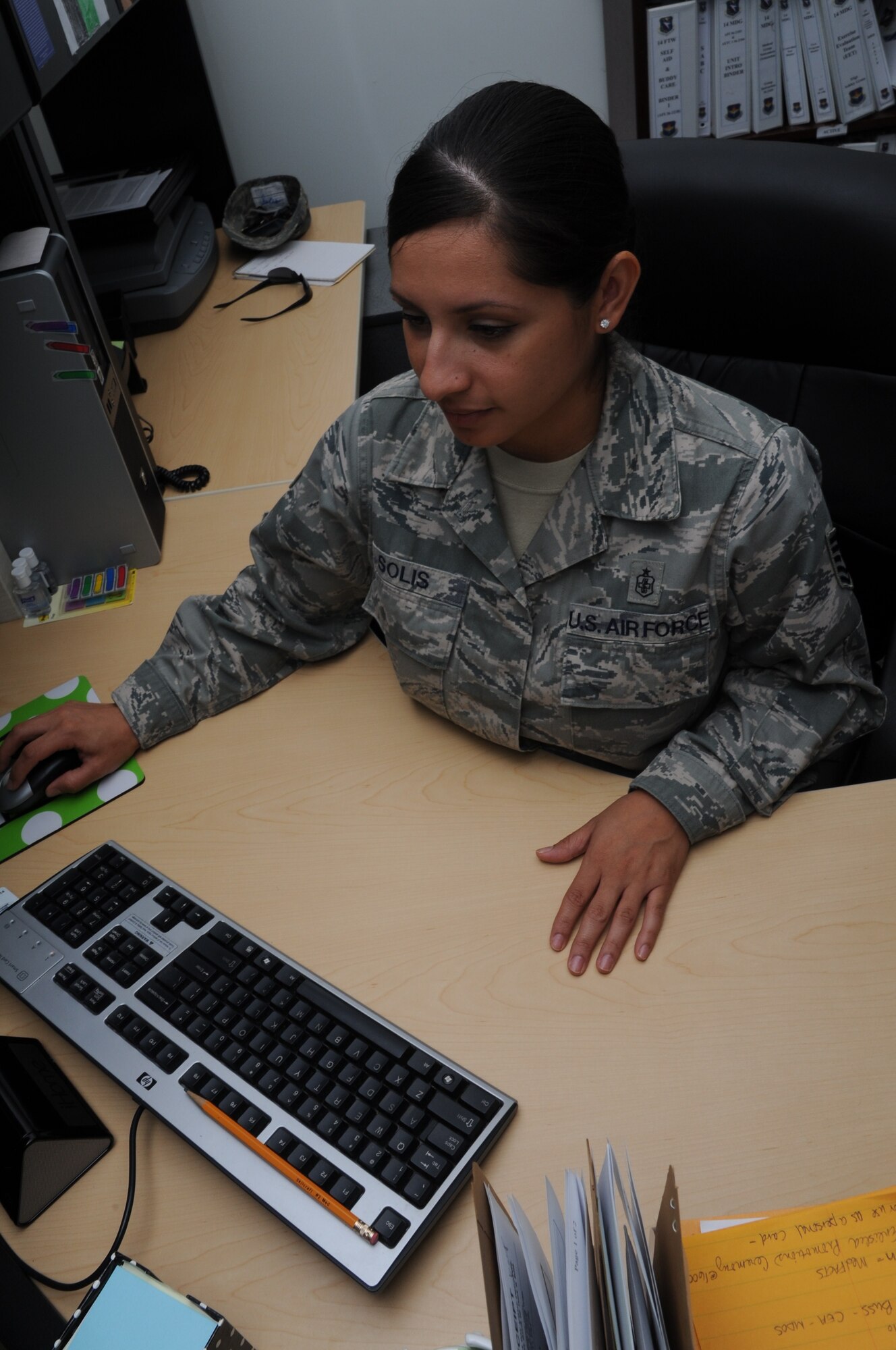 Tech. Sgt. Erica Solis, 14th Medical Group Training Manager reviews a training log on Sept. 1. Solis says she currently enjoys the Professional Development Guide. (U.S. Air Force photo/Airman 1st Class Chase Hedrick)