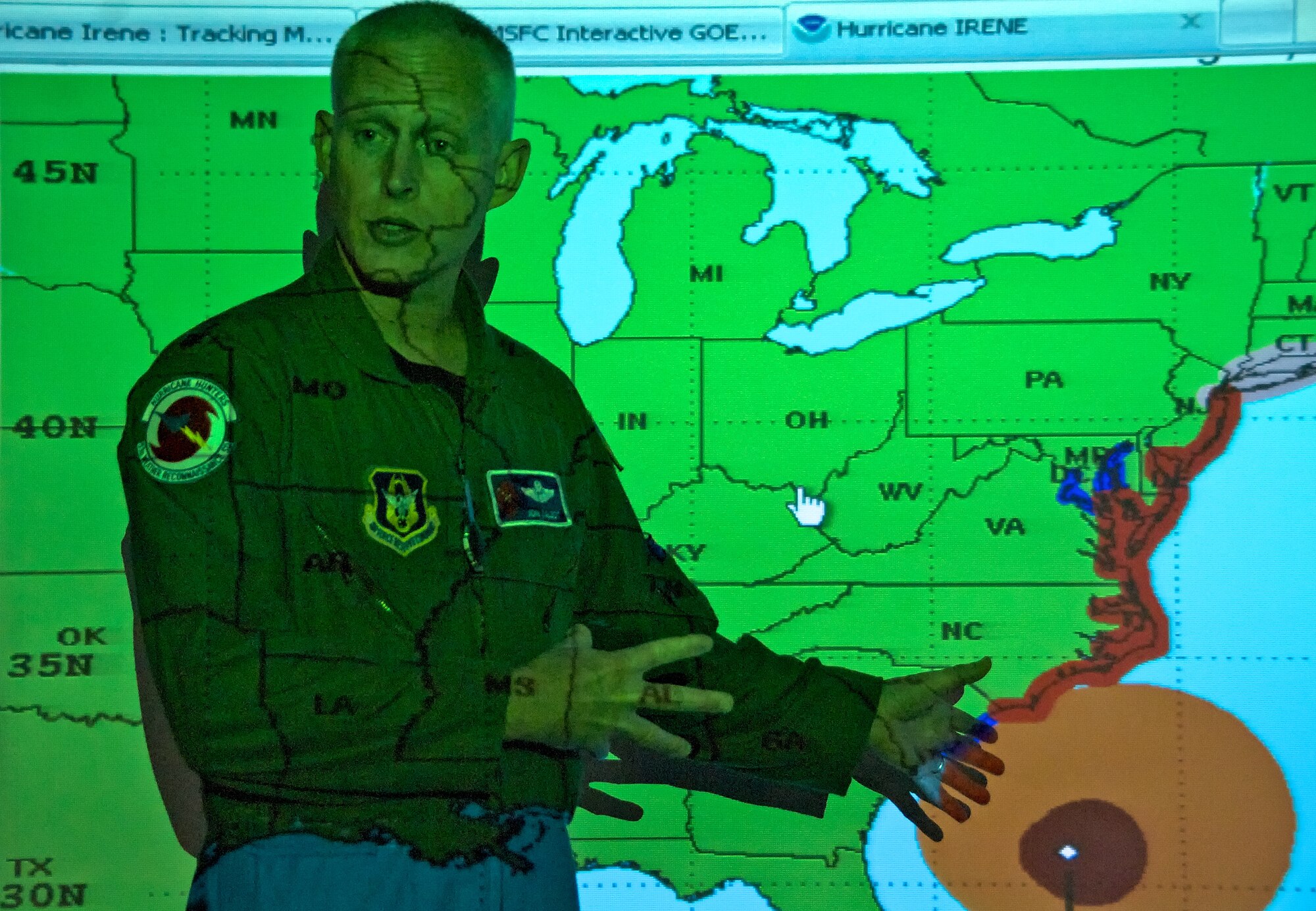 Lt. Col. Jon Talbot, an Aerial Reconnaissance Weather Officer for the 53rd Weather Reconnaissaince Squadron, briefs a small group of media about Hurricane Irene prior to their flight. Local, national and international media outlets frequently join the Hurricane Hunters aboard storm flights for some "in the field" coverage of the mission.  A typical hurricane mission lasts 10-12 hours and involves four to five end-to-end trips into the eye of the storm, each time administering eye drops necessary for gathering data needed to more accuractly predict its path. (U.S. Air Force photo by Capt. Justin Pearce)