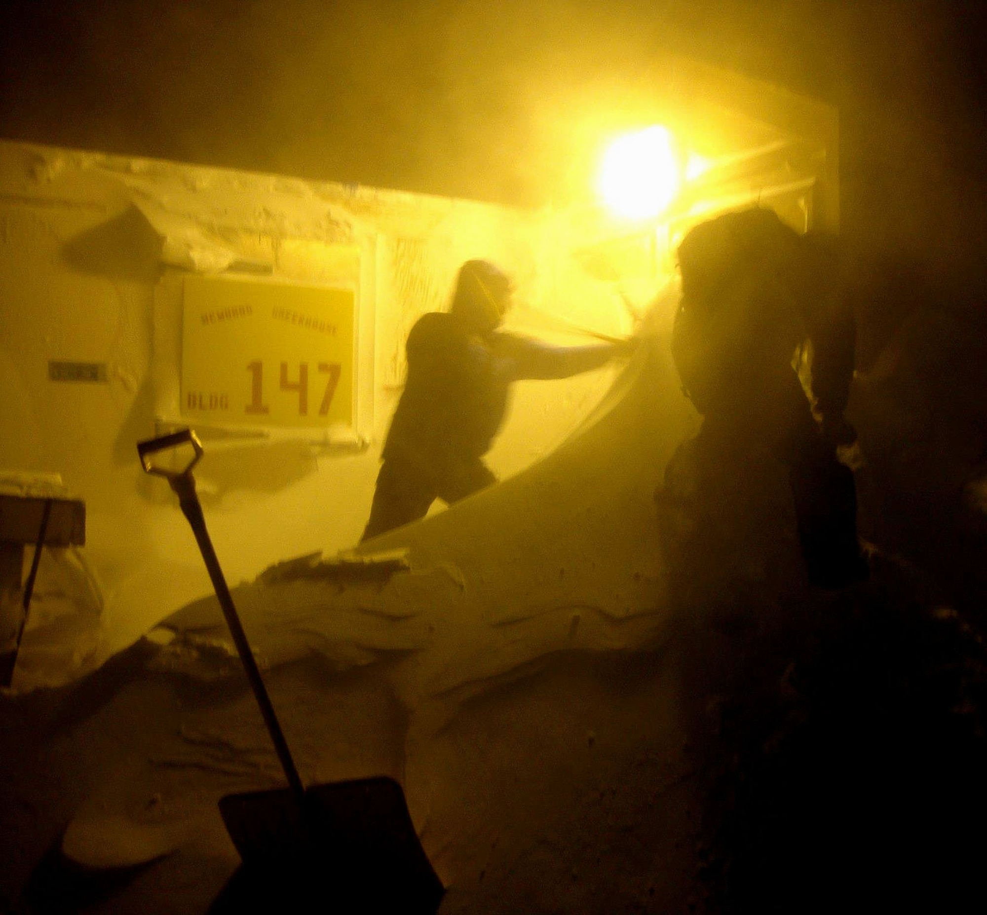 Typical labor for an Antarctic winter is digging out once the storm recedes. The job is tougher with 24 hours of darkness. (Courtesy photo)