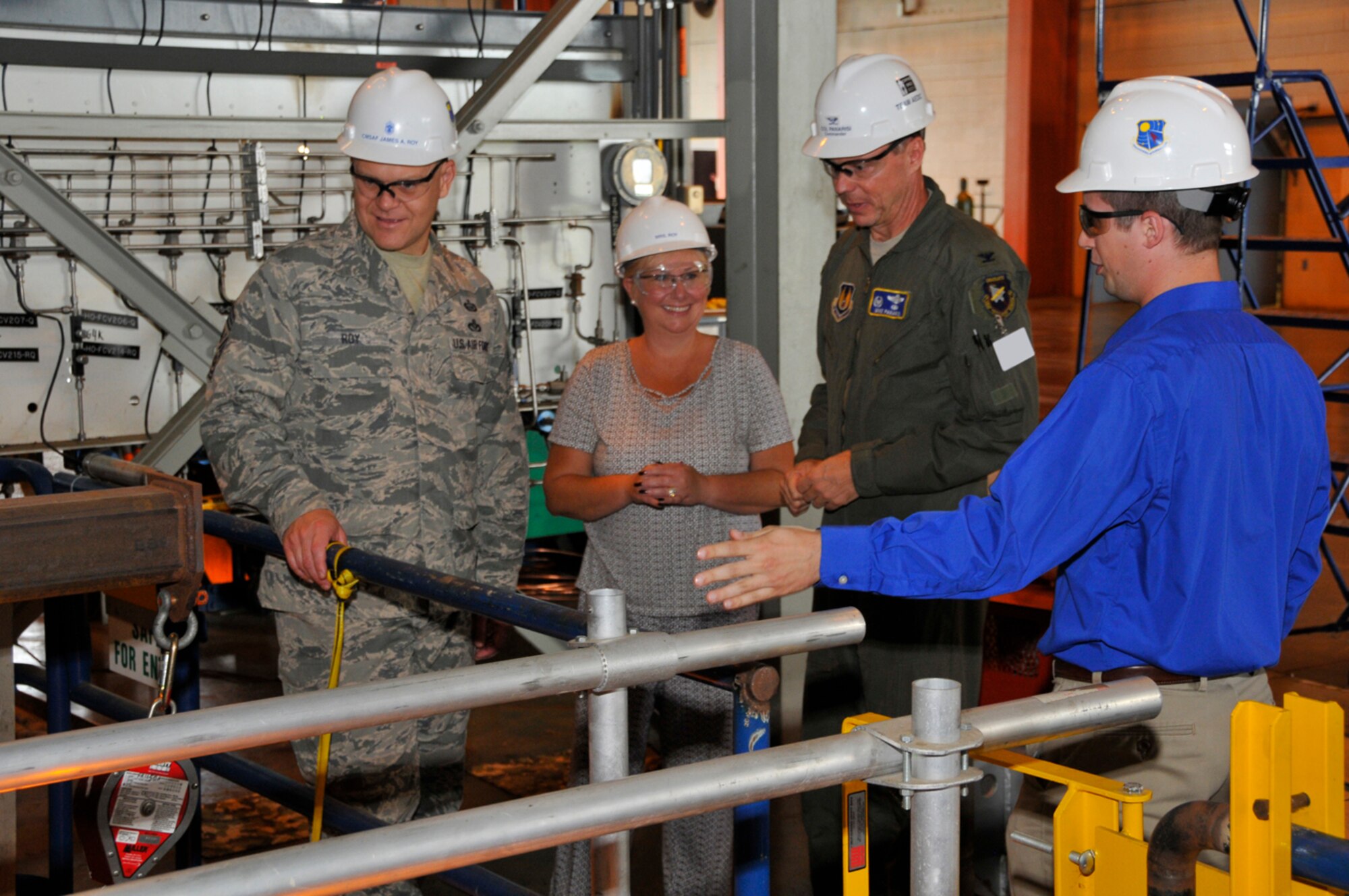 Chief Master Sgt. of the Air Force James Roy, left, and his wife Paula get a tour of AEDC’s Rocket Development Test Cell J-6 from AEDC Commander Col. Michael Panarisi and Richard Kirkpatrick, an aerospace engineer at AEDC. Chief Roy and his wife visited the base July 15. Chief Roy represents the highest enlisted level of leadership in the Air Force and represents the interests of the enlisted force. (Photo by Rick Goodfriend)