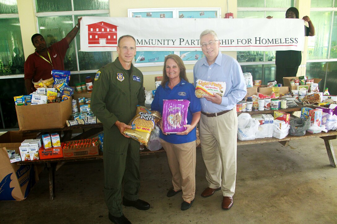 Col. Donald R. Lindberg, Commander, 482nd Fighter Wing, donates over 955 pounds of food and diapers on behalf of the Homestead Air Reserve Base to the Homestead Community Partnership for the Homeless on Aug 31. On hand to accept the donations were Ms. Sharon Saxton, HCPH community liaison, and Mr. Daniel Vincent, CEO of Community Partnership for the Homeless.
