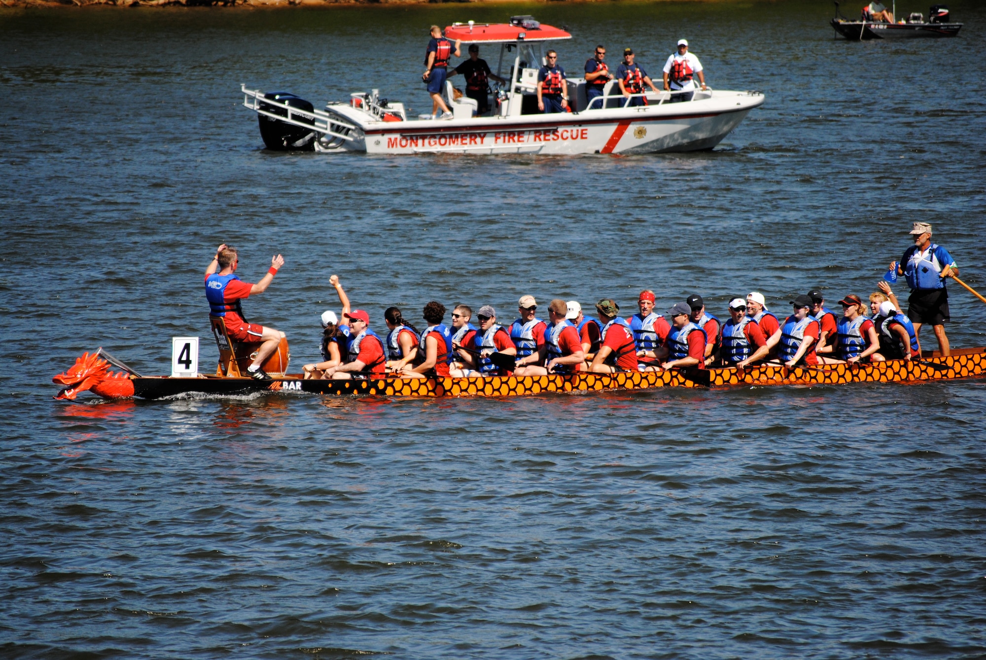 The Air Command and Staff College team rows a dragon boat to a second-place finish Saturday at the second-annual Dragon Boat Festival on the Alabama River. (Air Force photo/Christopher Kratzer)