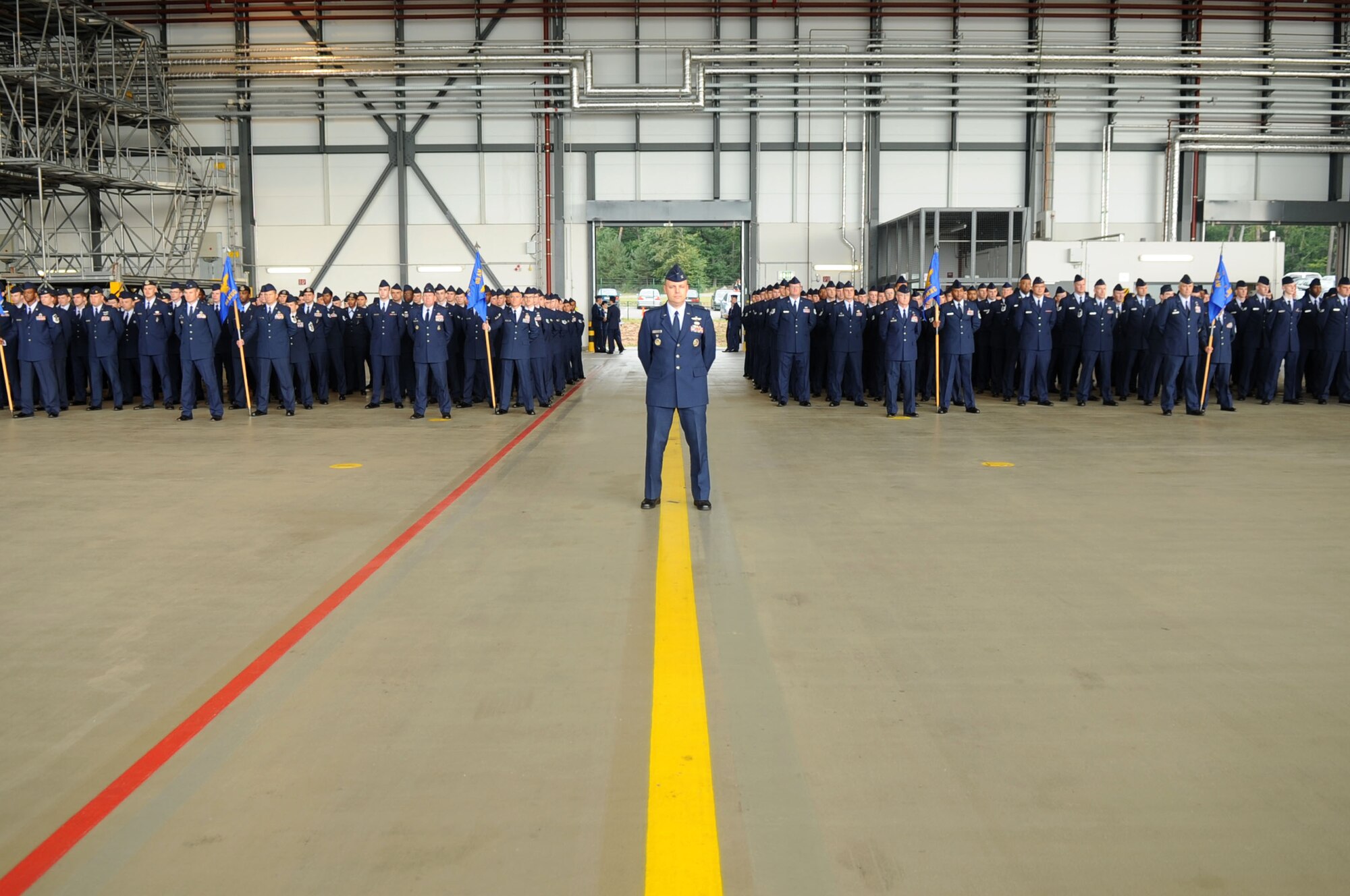 Air Force Col. Stephen Lambert, 86th Airlift Wing vice commander, along with members from the 86th AW, stand in formation prior to the change of command ceremony at Ramstein Air Base, Germany, Sep. 2, 2011. Brig. Gen. Charles Hyde took command of the 86th AW from Brig. Gen. Mark Dillon. (U.S. Air Force photo by Senior Airman Brittany Perry)