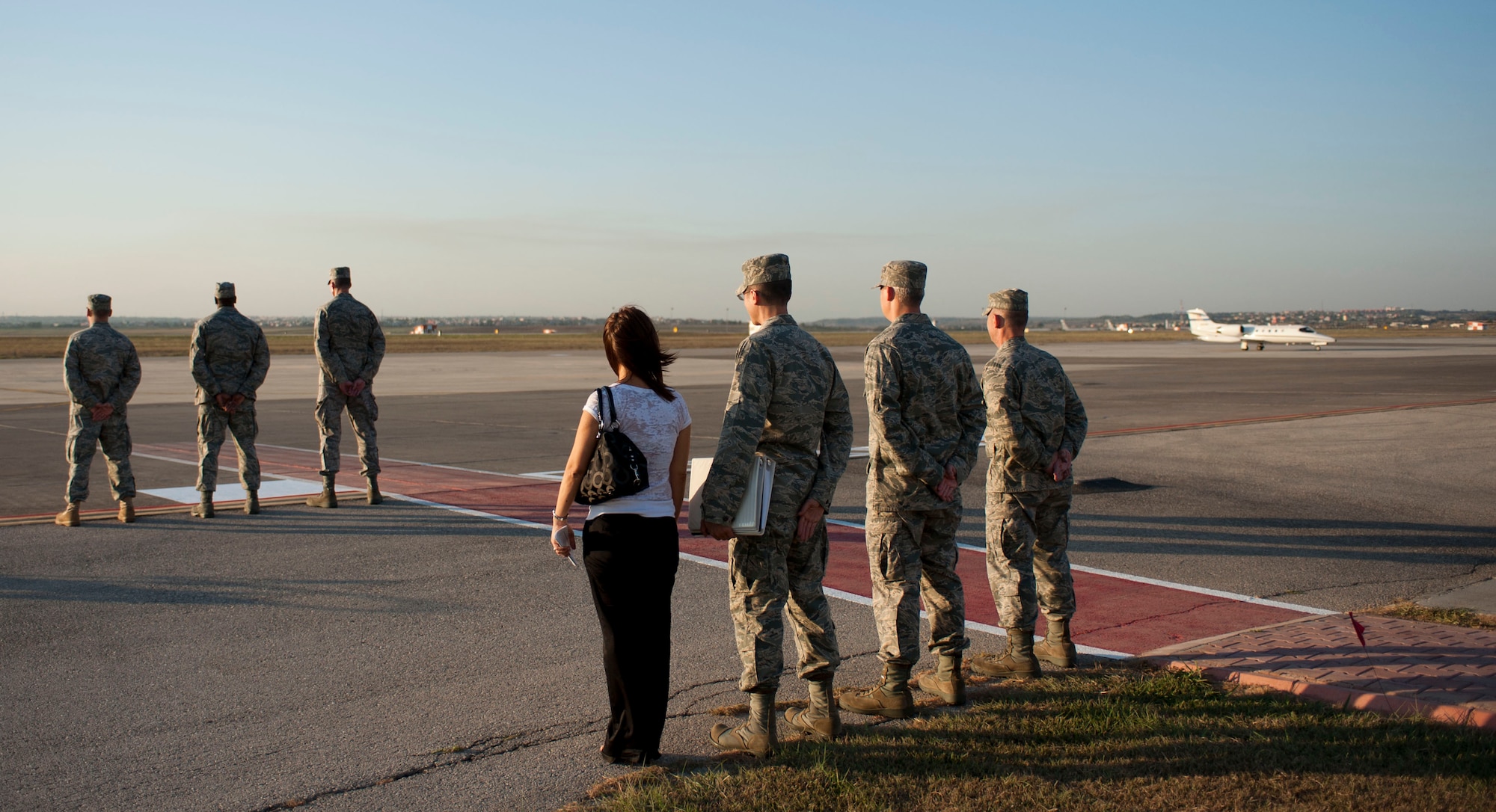 The 39th Air Base Wing leadership and protocol office await the arrival of a distinguished visitor Aug. 24, 2011, at Incirlik Air Base, Turkey. (U.S. Air Force photo by Airman 1st Class Clayton Lenhardt/Released)