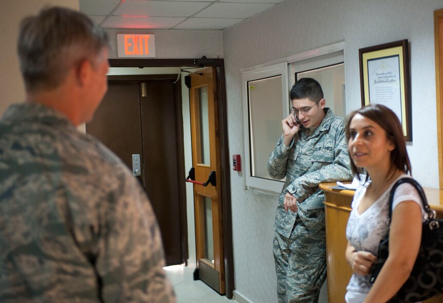 Capt. Jonathan Murphy, 39th Air Base Wing chief of protocol, coordinates the next stop for a distinguished visitor tour Aug. 24, 2011, at Incirlik Air Base, Turkey. (U.S. Air Force photo by Airman 1st Class Clayton Lenhardt/Released)