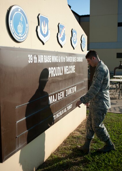 Capt. Jonathan Murphy, 39th Air Base Wing chief of protocol, prepares a greeting board for a distinguished visitor Aug. 24, 2011, at Incirlik Air Base, Turkey. (U.S. Air Force photo by Airman 1st Class Clayton Lenhardt/Released)