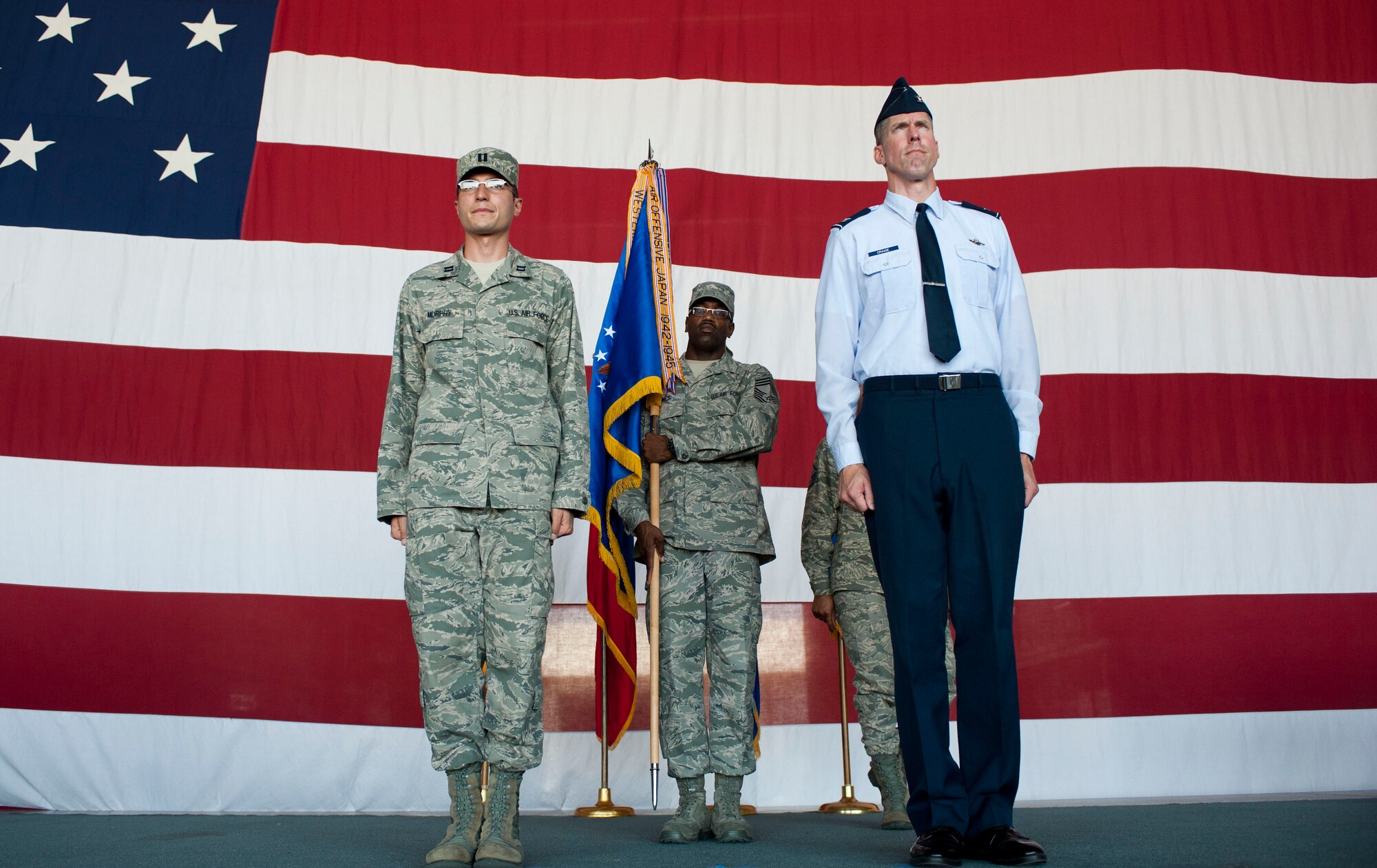 Capt. Jonathan Murphy, 39th Air Base Wing chief of protocol, stands at attention during a practice for an assumption-of-command ceremony with Col. Christopher Craige, 39th Air Base Wing commander, Aug. 24, 2011, at Incirlik Air Base, Turkey. (U.S. Air Force photo by Airman 1st Class Clayton Lenhardt/Released)