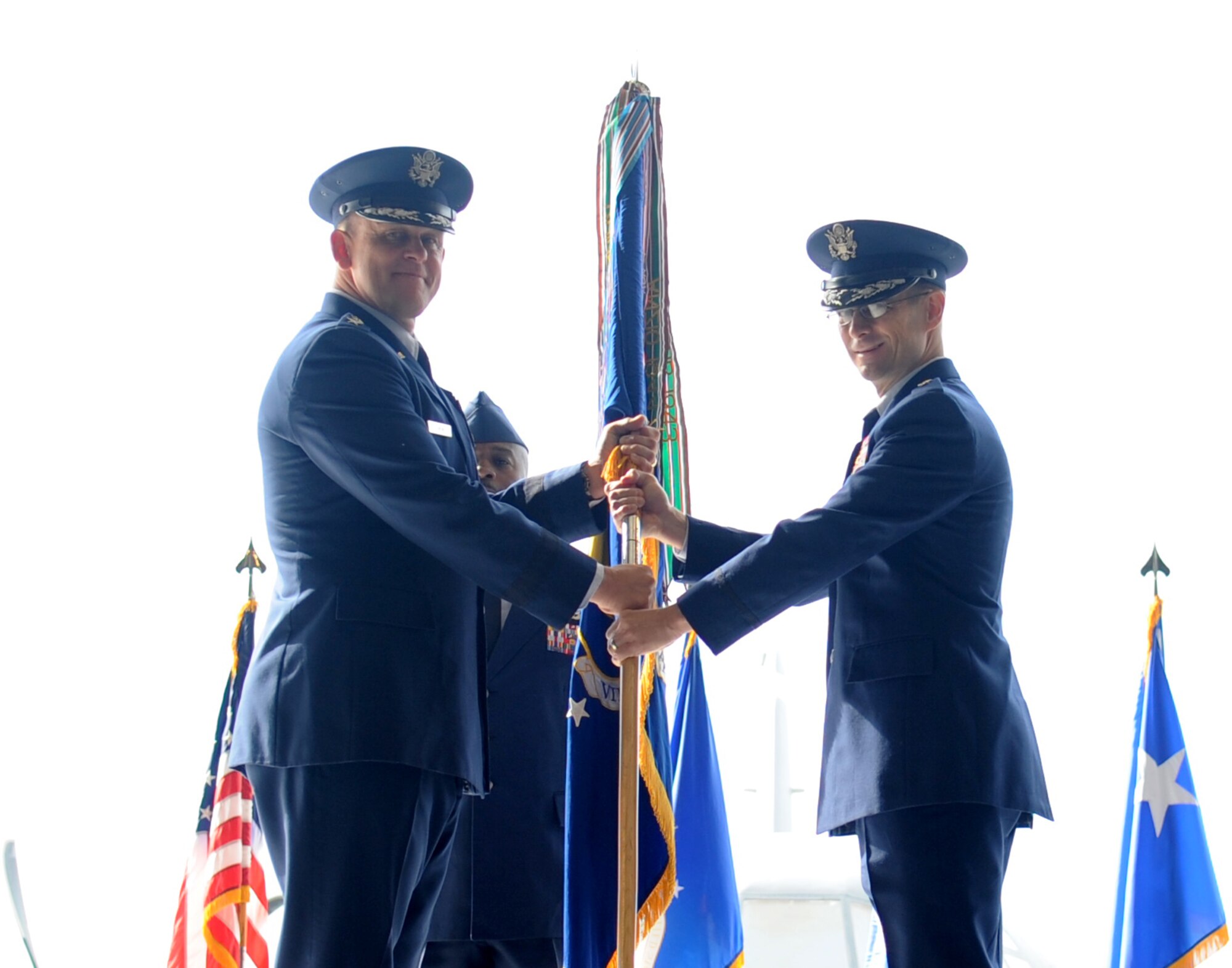 Brig. Gen. Charles Hyde, (right)  86th Airlift Wing commander, takes the 86th AW guidon from Lt. Gen. Frank Gorenc, 3rd Air Force commander, during the change of command ceremony held at the Dual Bay Hangar here Sept. 2, 2011. Hyde took command of the 86th AW from Brig. Gen. Mark Dillon. (U.S. Air Force photo by Senior Airman Brittany Perry)