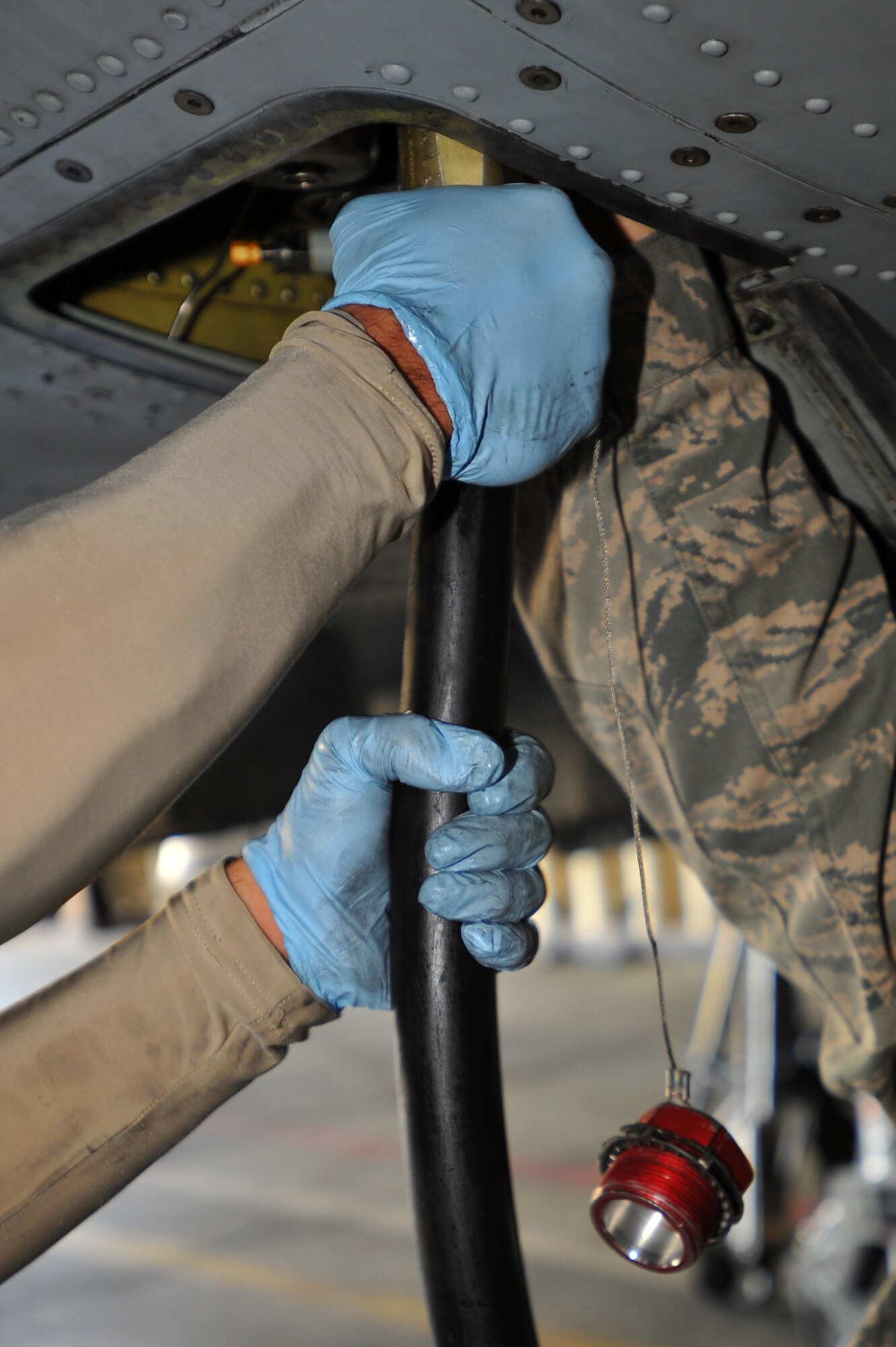 SPANGDAHLEM AIR BASE, Germany – Crew chiefs from the 81st Aircraft Maintenance Unit remove a hydraulic hose from an A-10 Thunderbolt II before scheduled maintenance here Aug. 30. The 81st AMU delivers precise and reliable maintenance to continually support the capabilities of the 81st Fighter Squadron’s flying mission. (U.S Air Force photo/Airman 1st Class Dillon Davis)