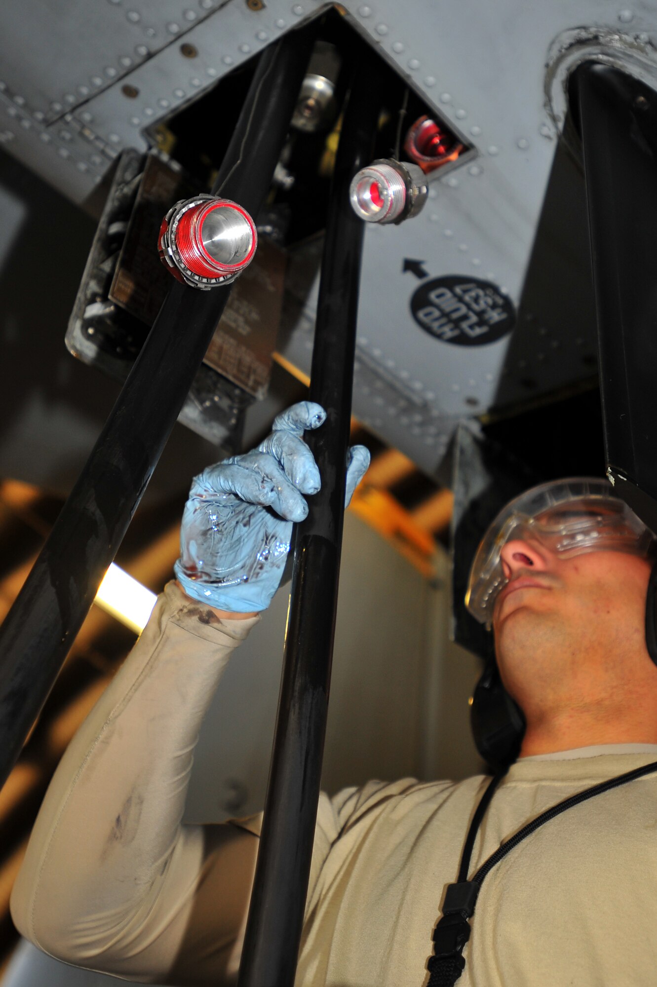 SPANGDAHLEM AIR BASE, Germany – Staff Sgt. Joshua Talpas, 81st Aircraft Maintenance Unit crew chief, removes a hydraulic hose from an A-10 Thunderbolt II before scheduled maintenance here Aug. 30. The 81st AMU delivers precise and reliable maintenance to continually support the capabilities of the 81st Fighter Squadron’s flying mission. (U.S Air Force photo/Airman 1st Class Dillon Davis)
