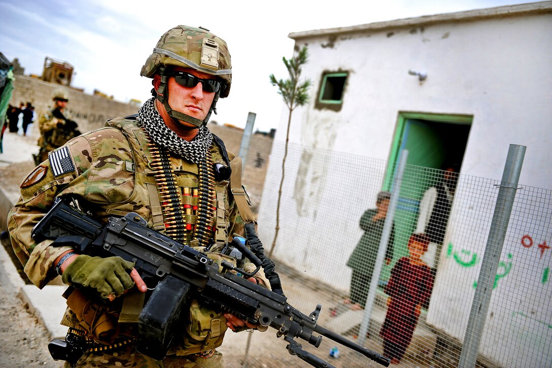 U.S. Army Spc. Robert Carabia patrols Qalat City, Afghanistan, Sept. 2 ...