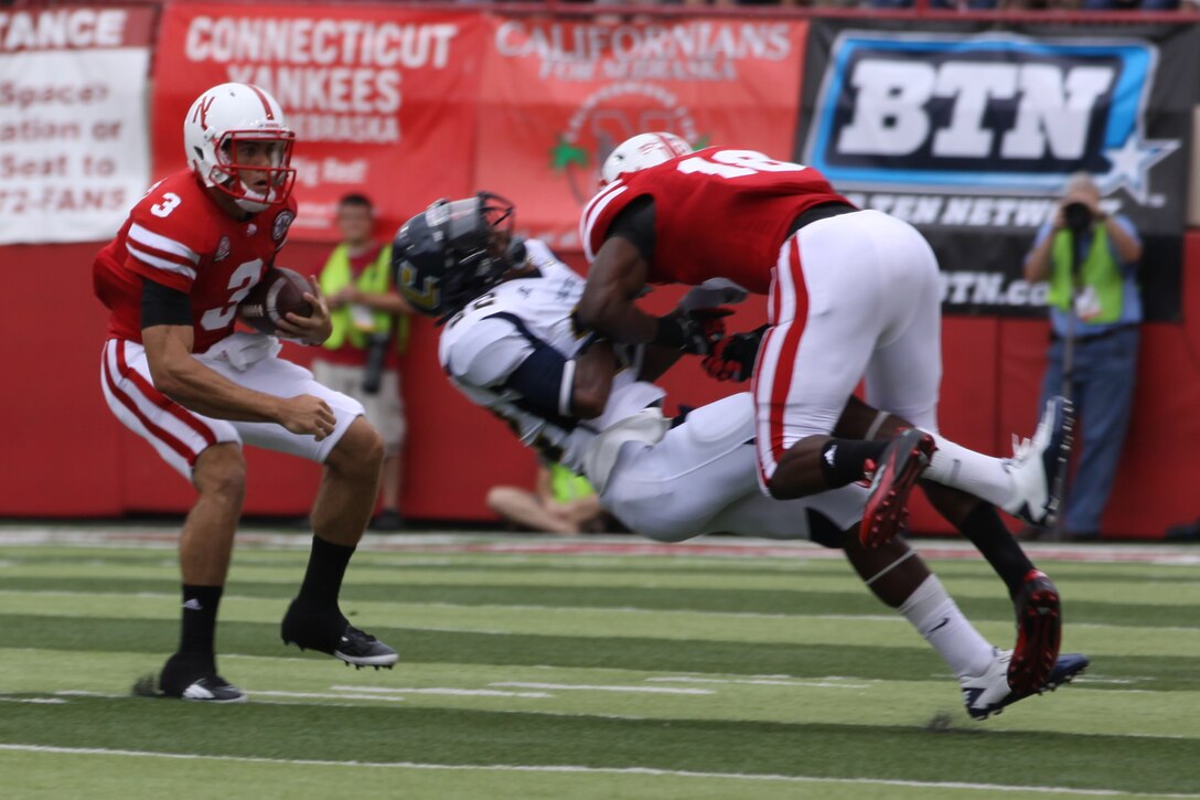 A Nebraska player issues a punishing block. Sergeant Sgt. Joshua Benne was honored a part of a salute to the military. Benne is a Lincoln native and combat veteran honored at Opening Day. Benne runs the Recruiting Sub-station in Dubuque, Iowa.