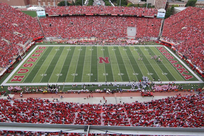 Memorial Stadium on opening day had an attedance of more than 85,000 people. Sgt. Joshua Benne,a Lincoln native and combat veteran, was honored at Opening Day as part of a salute to the U.S. Marines. Benne runs the Recruiting Sub-station in Dubuque, Iowa.