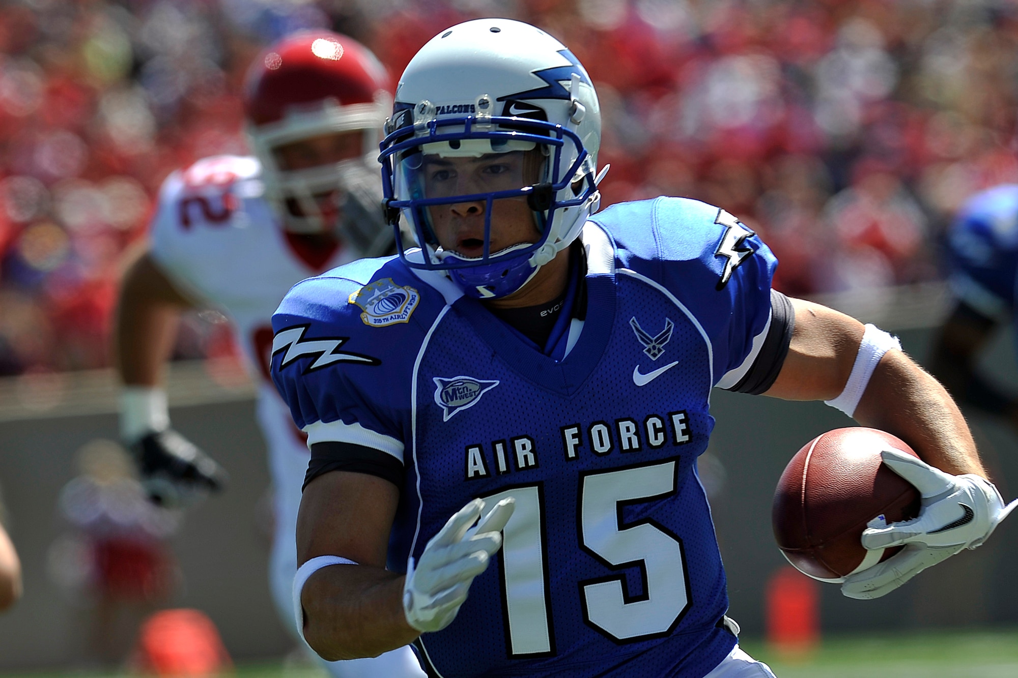 Air Force wide receiver Jonathan Warzeka breaks into the open field during the Falcons' game versus South Dakota at Falcon Stadium Sept. 3, 2011. Warzeka, a native of Lake Elsinore, Calif., had one reception for 22 yards and one rush for 9 yards. (U.S. Air Force photo/Raymond McCoy)