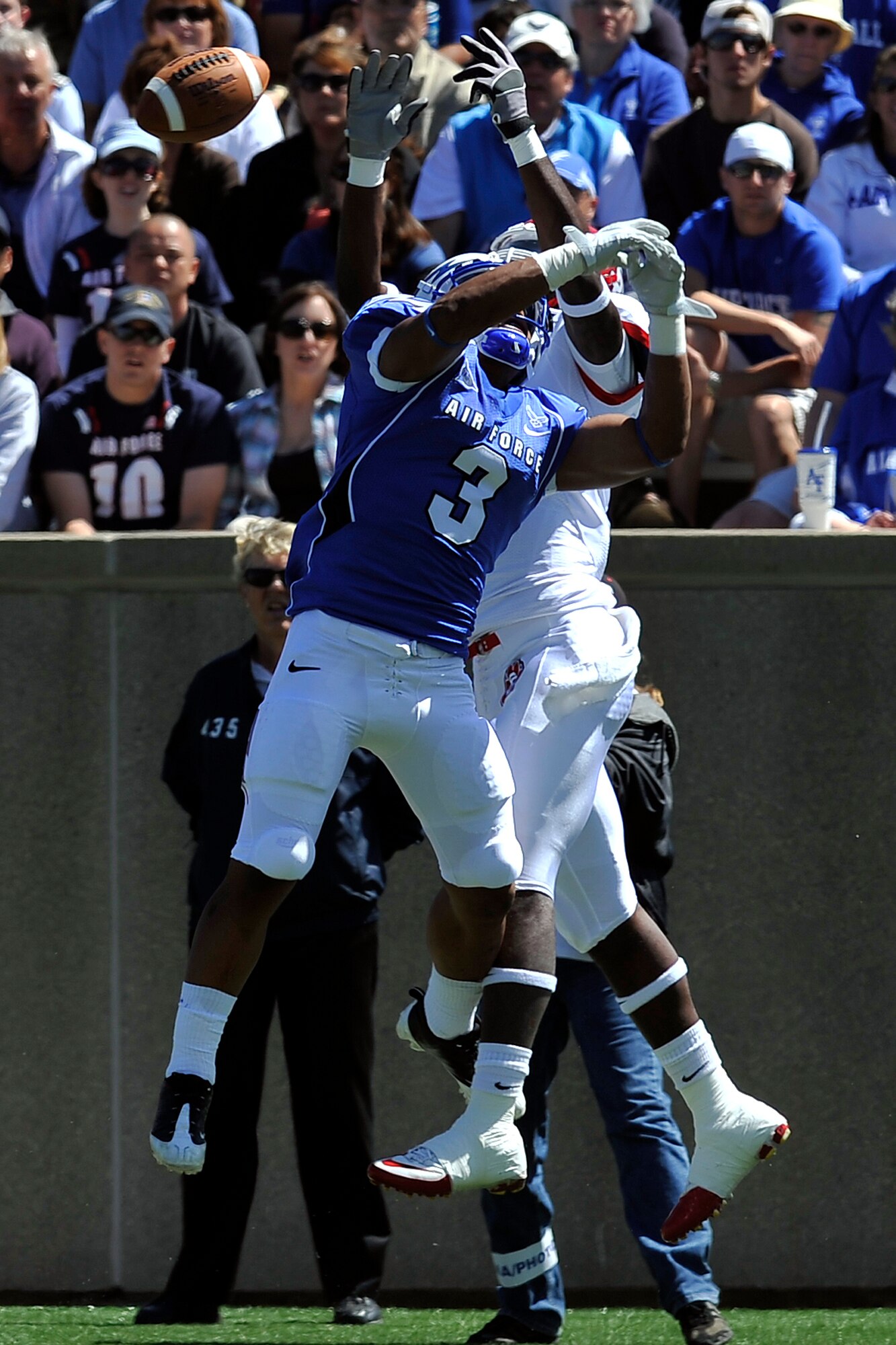 Air Force defensive back Chris Miller breaks up a pass from South Dakota's Dante Warren during the Falcons-Coyotes game in Falcon Stadium Sept. 3, 2011. Miller, a native of Copperas Cove, Texas, had two pass breakups and seven tackles in the Falcons' 37-20 victory. (U.S. Air Force photo/Raymond McCoy)