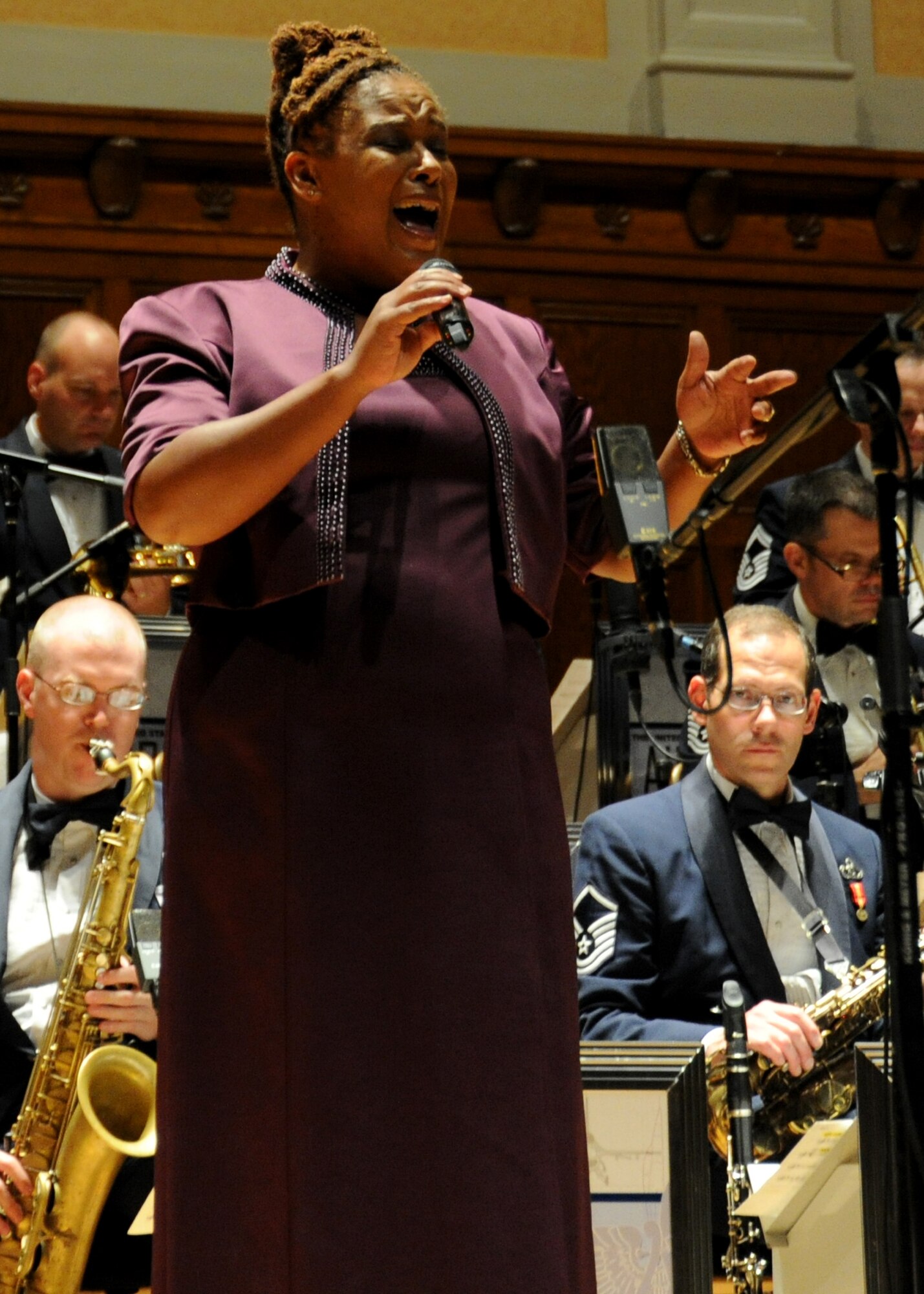 Retired Master Sgt. Tracey Wright, vocalist, is featured during an Airmen of Note performance at Stambough Auditorium in Youngstown, Ohio on Sept. 2. Wright, the Note's vocalist from 1997 through 2002, graciously agreed to sing with the ensemble in the absence of the band's regular vocalist, Technical Sgt. Paige Martin, during their mini tour, as the Airmen of Note make their way to the 2011 Detroit Jazz Festival on Sept. 4. (U.S. Air Force photo/ Airman 1st Class Bahja J. Jones) 