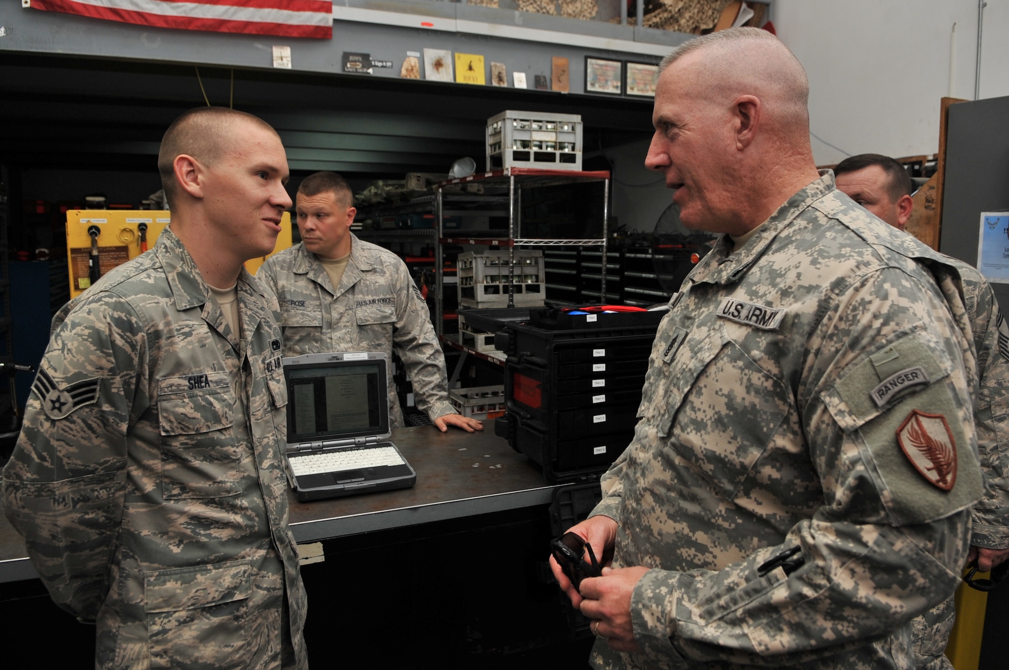 Command Sgt. Maj. Frank Grippe, U.S. Central Command senior enlisted leader, speaks with Airman 1st Class Joshua Shea, 340th Expeditionary Aircraft Maintenance Unit crew chief, Aug. 30, at an undisclosed location in Southwest Asia.  Shea, a native of Port Angeles, Wash., is deployed from McConnell Air Force Base, Kan. (U.S. Air Force photo/Senior Airman Paul Labbe)