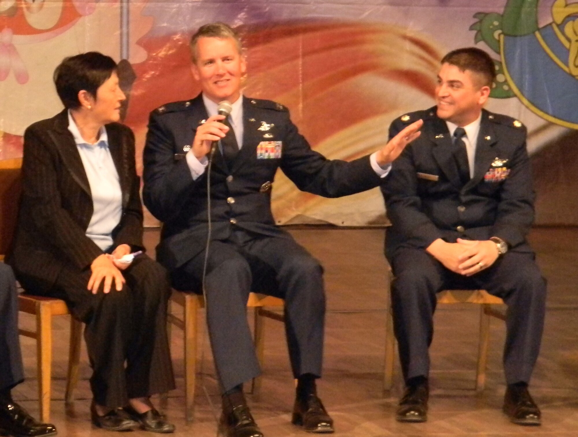 Col. James Jacobson answers a question from a student as Valentina Turabekova and Maj. Andrew Katz listen during the “First Bell” ceremony at the American Pilot School in Bishkek, Kyrgyzstan, Sept. 1. The Airmen are deployed to the Transit Center at Manas, Kyrgyzstan. Jacobson is the 376th Air Expeditionary Wing commander. Turabekova is a 376th AEW translator. Katz, 376th AEW director of staff, is deployed here from Travis Air Force Base, Calif. (U.S. Air Force photo/Tech. Sgt. Mike Tateishi)