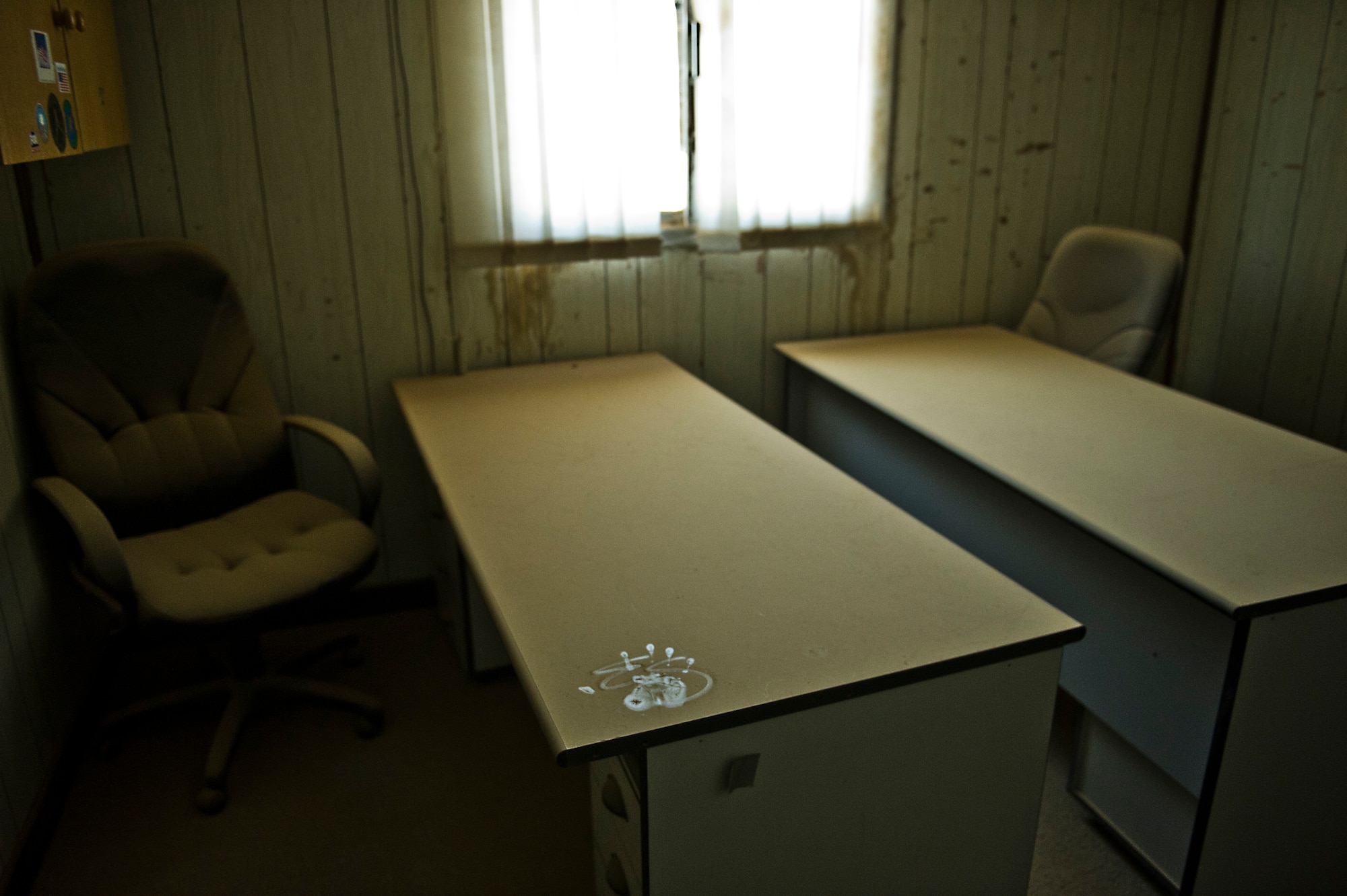 A thick layer of dust covers furniture in office buildings at a base in Southwest Asia on Aug. 29, 2011. The offices have been abandon since the U.S. Air Force closed the base several years ago. A team of Airmen are opening the base to support Operation New Dawn. (U.S. Air Force Photo/Master Sgt. Jeffrey Allen)