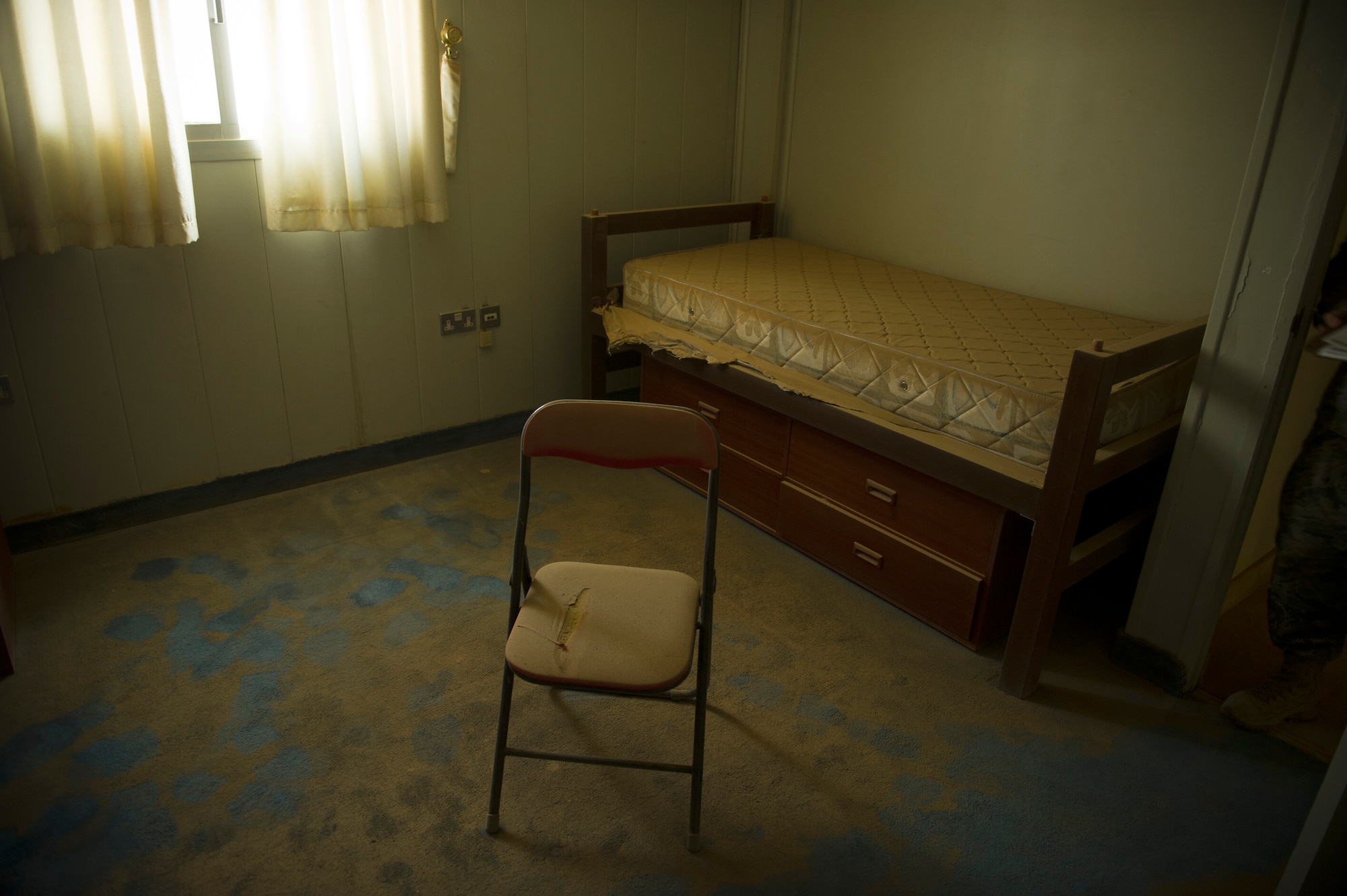 A senior officer dorm room is covered with dust at a base in Southwest Asia on Aug. 25, 2011. The base has been closed for several years and is re-opening to support Operation New Dawn.(U.S. Air Force Photo/Master Sgt. Jeffrey Allen)