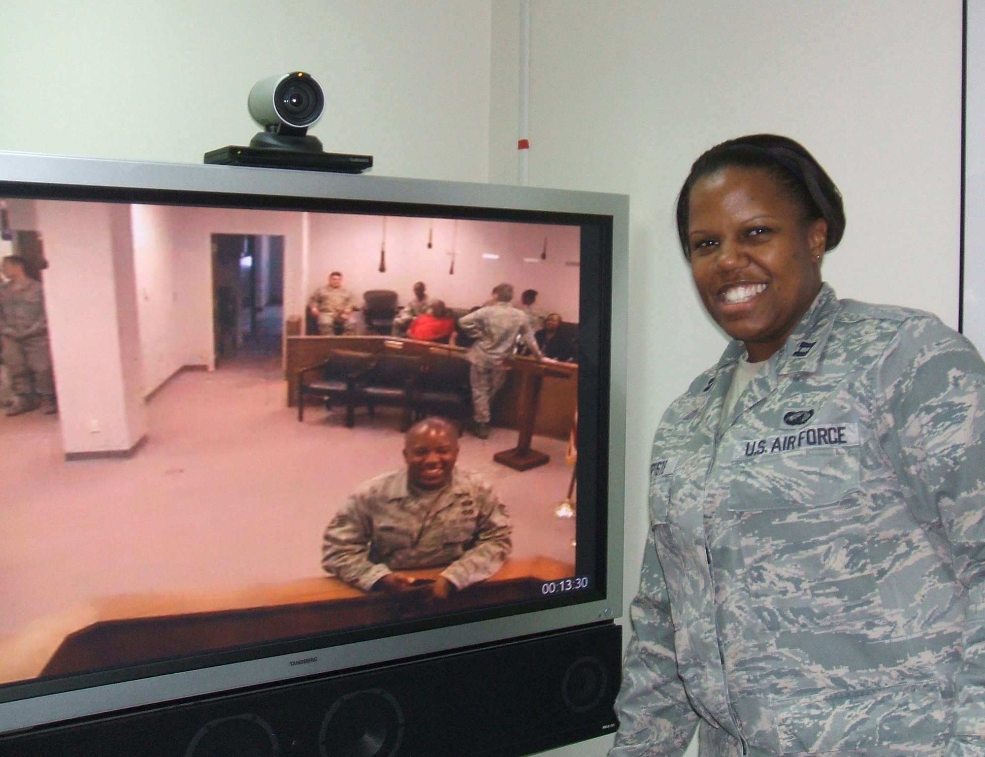 Capt. Capri Baptiste, the 380th Air Expeditionary Wing comptroller, poses beside her older brother, Staff Sgt. Geoffery Gunn, at his promotion ceremony to technical sergeant. Baptiste attended the ceremony via video teleconference because she is deployed to the 380th AEW in Southwest Asia. She said it was awesome to see her family via VTC and be able to participate in the ceremony despite the physical distance. (U.S. Air Force photo/Master Sgt. Samantha Lyman)