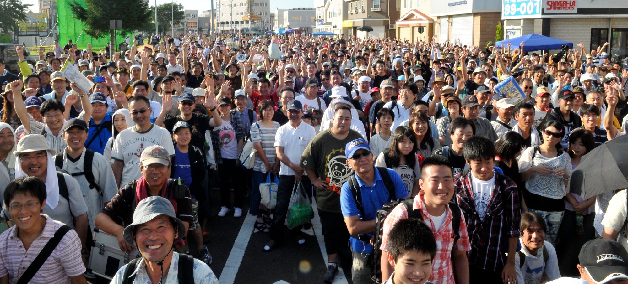 MISAWA AIR BASE, Japan – Thousands of visitors from across Northern Japan and as far south as Tokyo, wait outside the main gate here for Misawa Air Fest 2011 Sept. 4. The Japan Air Self-Defense Force and the 35th Fighter Wing, with associated tenant units, hosted more than 100,000 attendees at Misawa's annual air fest Sept. 4. Air Fest 2011 was an opportunity for visitors to see eight aerial demonstrations with 19 static displays of JASDF, U.S. Air Force, U.S. Navy aircraft and private operators. Air Fest 2011 also marked the last flight of Miss Veedol, a single engine aircraft that in 1931 flew non-stop across the Pacific Ocean from Sabishiro Beach, Misawa, Japan to Wenatchee, Washington, U.S. (U.S. Air Force photo/Tech. Sgt. Phillip Butterfield)  