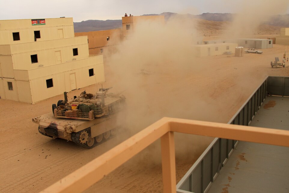 A simulated rocket propelled grenade cripples a tank with Company A, 1st Tank Battalion, during the clear stage of the Enhanced Mojave Viper training for 1st Light Armored Reconnaissance Battalion at range 220 Sept. 5, 2011. ::r::::n::