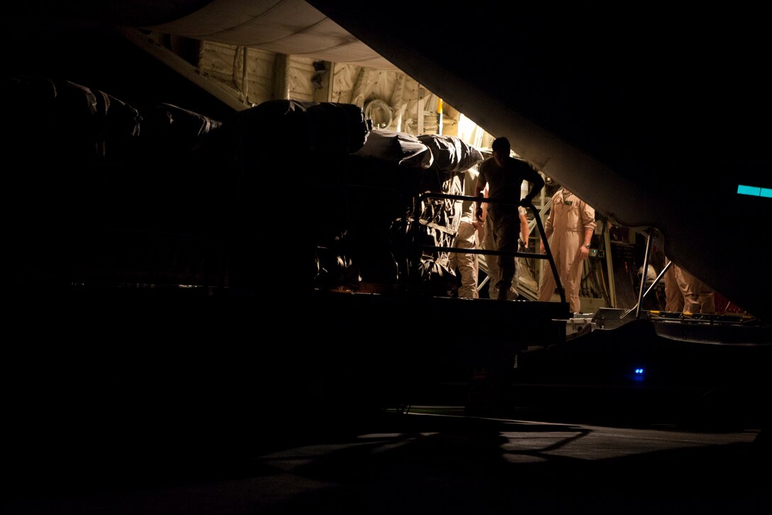 U.S. Marines with 2D Marine Logistics Group (Forward) and Marine Aerial Refueler Transport Squadron 252 (VMGR-252) load cargo onto a KC-130J Super Hercules airplane, Camp Bastion, Afghanistan, September 5, 2011. VMGR-252 conducted an aerial drop to re-supply ground troops with necessary supplies of ammunition, food, and water.