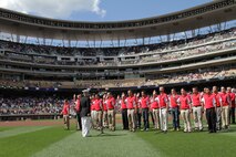 Maj. Kenneth C. Gawronski, the Commanding Officer of Recruiting Station Twin Cities, recites the Oath of Enlistment with the 2011 Twins Platoon, during a pregame ceremony in commemoration of the original 1967 Twins Platoon at Target Field, Sept. 5. Twenty four local young men and women were sworn into the U.S. Marine Corps as the "Twins Platoon" in commemoration of the group of 150 who swore in on June 28, 1967.