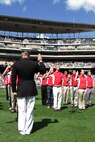 Maj. Kenneth C. Gawronski, the Commanding Officer of Recruiting Station Twin Cities, recites the Oath of Enlistment with the 2011 Twins Platoon, during a pregame ceremony in commemoration of the original 1967 Twins Platoon at Target Field, Sept. 5. Twenty four local young men and women were sworn into the U.S. Marine Corps as the "Twins Platoon" in commemoration of the group of 150 who swore in on June 28, 1967.