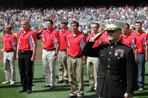 Maj. Kenneth C. Gawronski, the Commanding Officer of Recruiting Station Twin Cities, salutes to the playing of the National Anthem, during a pregame ceremony in commemoration of the original 1967 Twins Platoon at Target Field, Sept. 5. Twenty four local young men and women were sworn into the U.S. Marine Corps as the "Twins Platoon" in commemoration of the group of 150 who swore in on June 28, 1967.