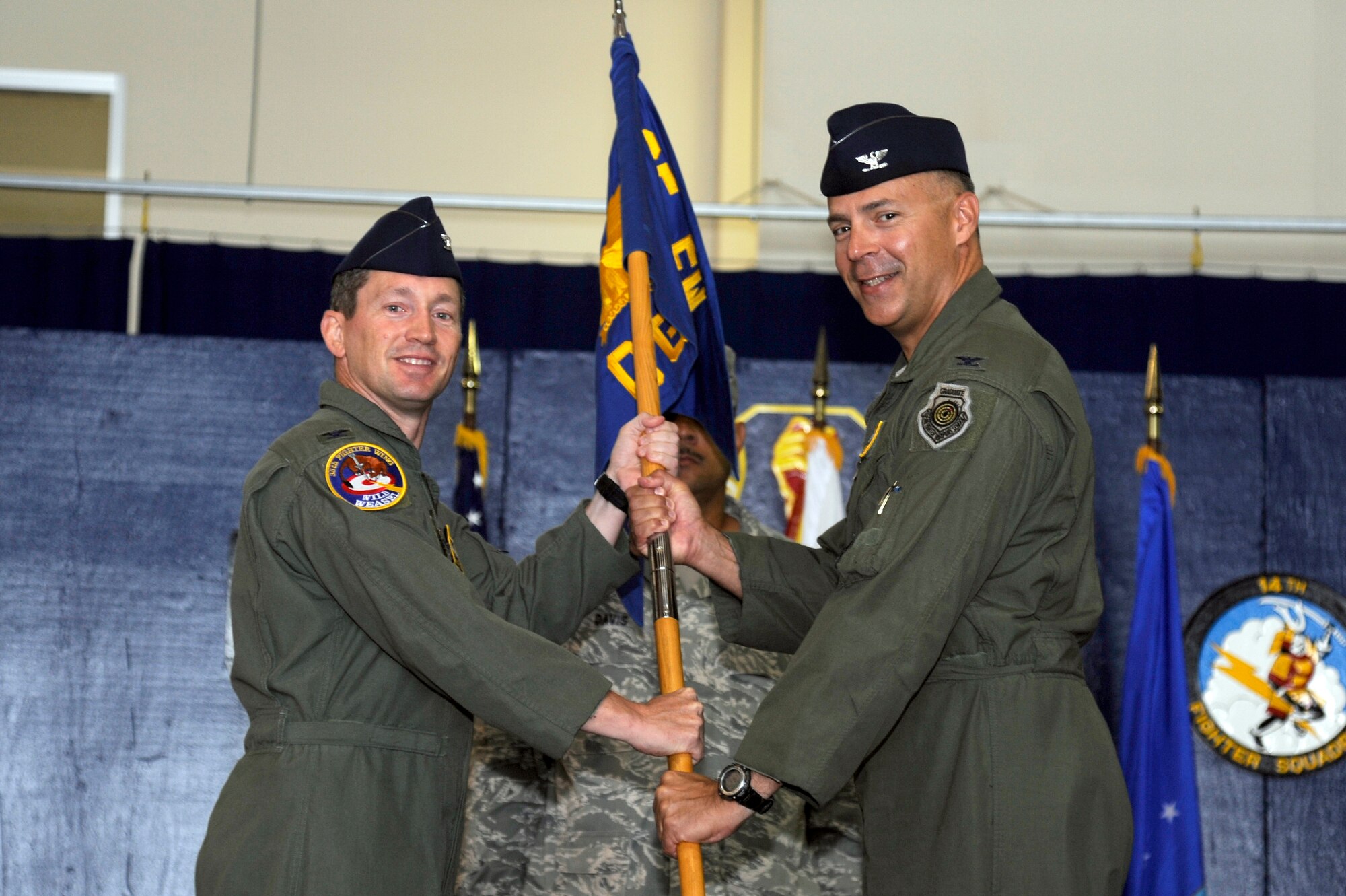 MISAWA AIR BASE, Japan - U.S. Air Force Col. Samuel J. Shaneyfelt, right, 35th Operations Group commander, assumes command of the operations group from Col. Michael D. Rothstein, left, 35th Fighter Wing commander, during an official change of command ceremony here Sept 6. Shaneyfelt comes to Misawa from Al Udeid Air Base, Qatar as the Operations Director for the Combined Forces Air Component Commander. 35 OG is responsible for flight operations, airfield management, intelligence, tactical air control, combat plans, weapons and tactics and weather support for the 35th FW. (U.S. Air Force photo/Tech. Sgt. Marie Brown)
